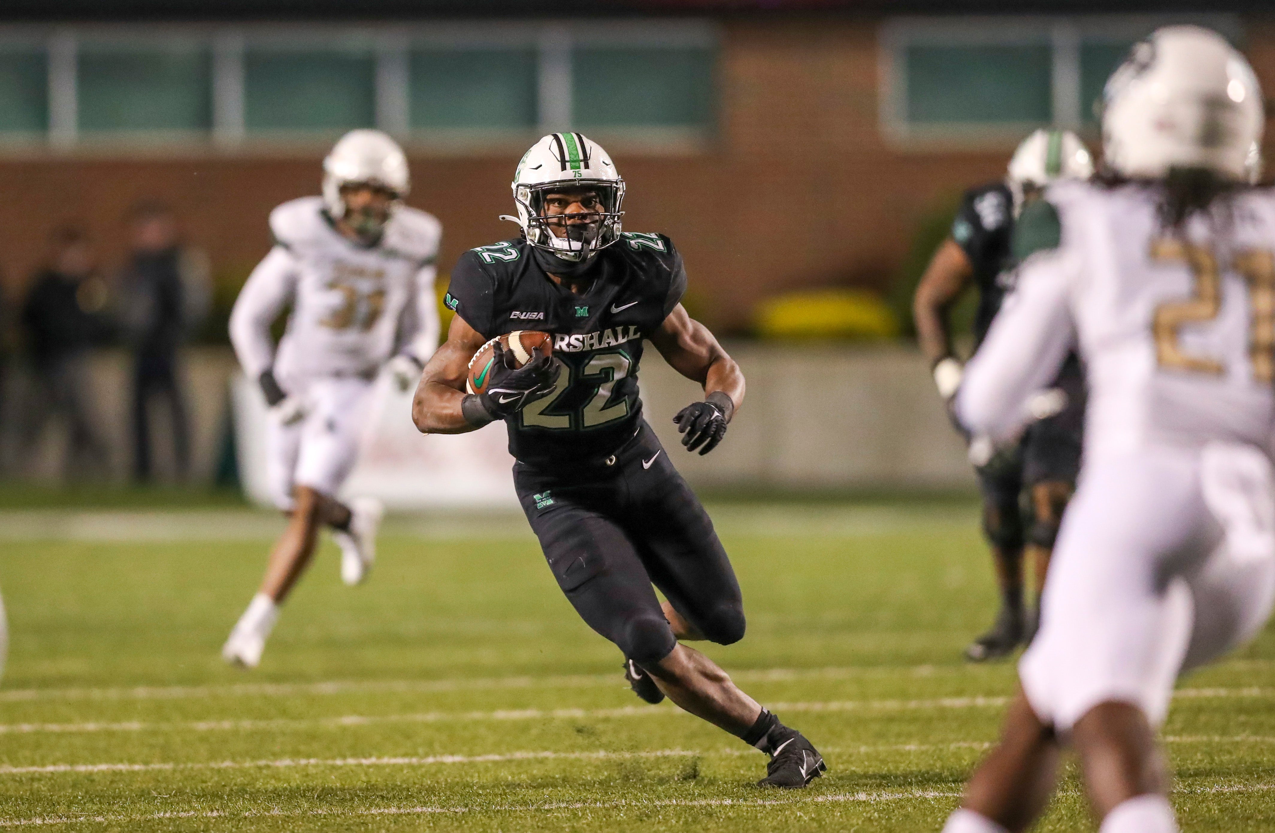Nov 13, 2021; Huntington, West Virginia, USA; Marshall Thundering Herd running back Rasheen Ali (22) runs the ball after a catch against the UAB Blazers during the third quarter at Joan C. Edwards Stadium.