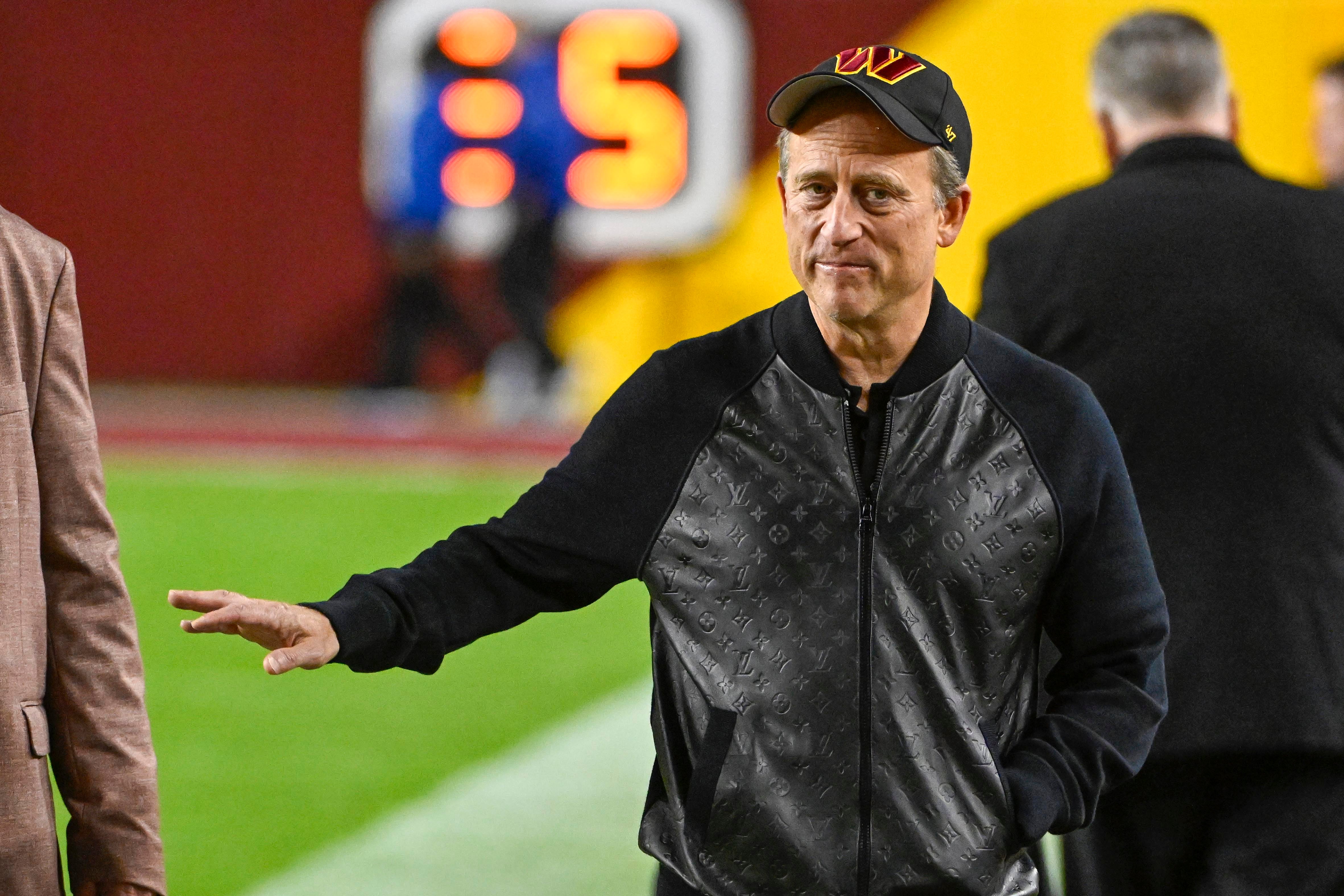 Washington Commanders owner Josh Harris on the field before the game against the Chicago Bears at FedExField.