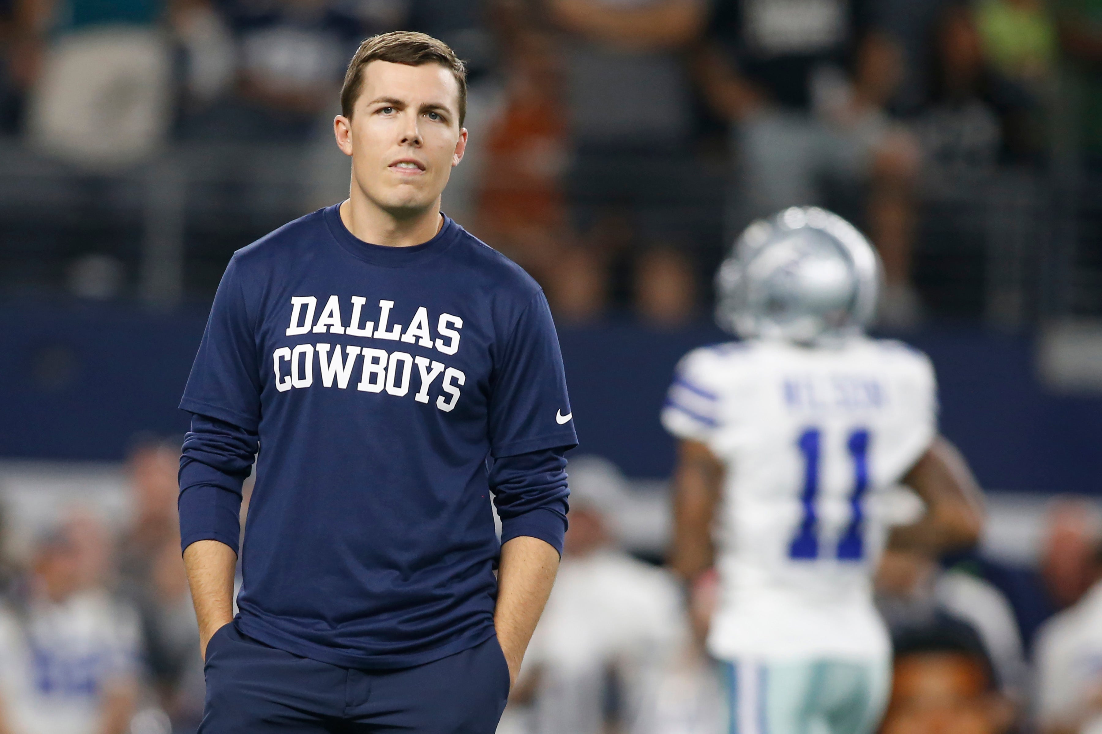 Dallas Cowboys offensive coordinator Kellen Moore on the field before the game against the Philadelphia Eagles at AT&T Stadium.