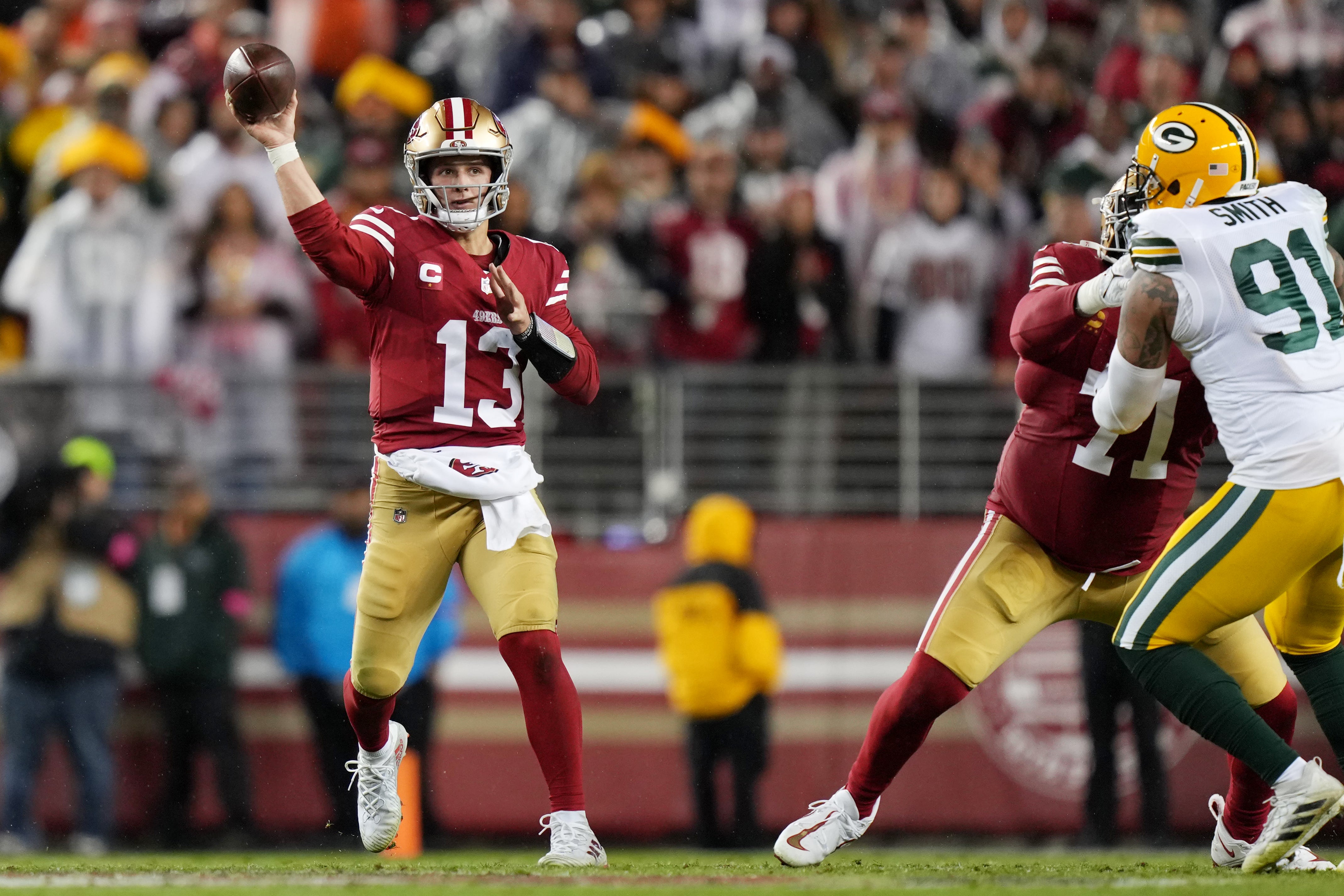 January 20, 2024; Santa Clara, CA, USA; San Francisco 49ers quarterback Brock Purdy (13) throws a pass against the Green Bay Packers during the fourth quarter in a 2024 NFC divisional round game at Levi's Stadium.