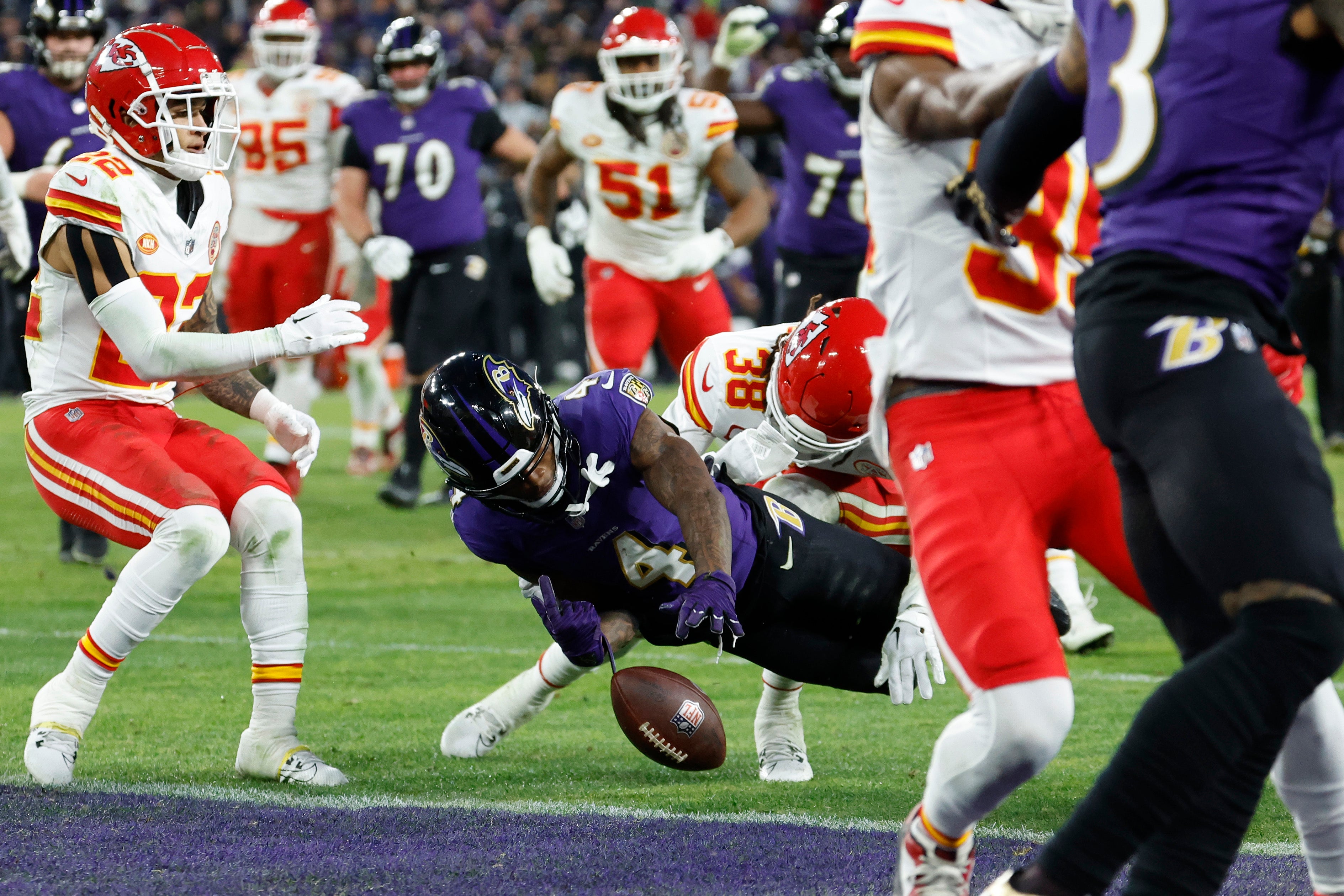 Baltimore Ravens wide receiver Zay Flowers fumbles the ball as Kansas City Chiefs cornerback L'Jarius Sneed defends during the second half in the AFC Championship football game at M&T Bank Stadium.