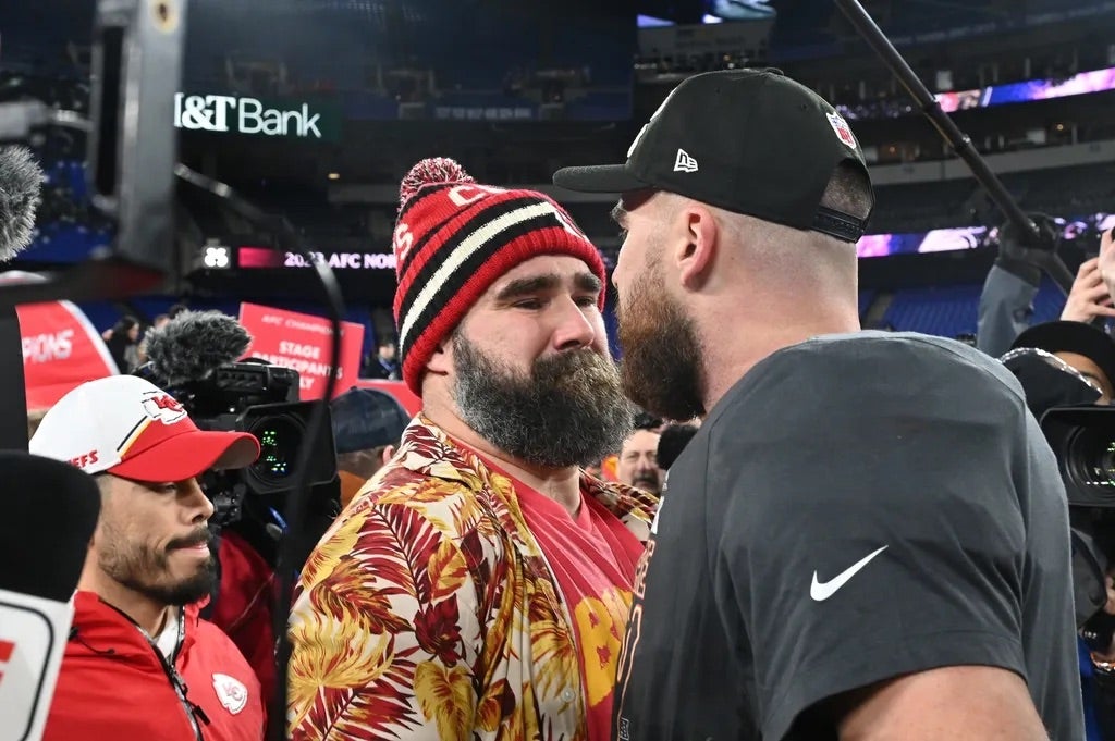 Kansas City Chiefs tight end Travis Kelce (87) celebrates with Jason Kelce (center) after the Kansas City Chiefs won the AFC Championship football game against the Baltimore Ravens at M&T Bank Stadium.