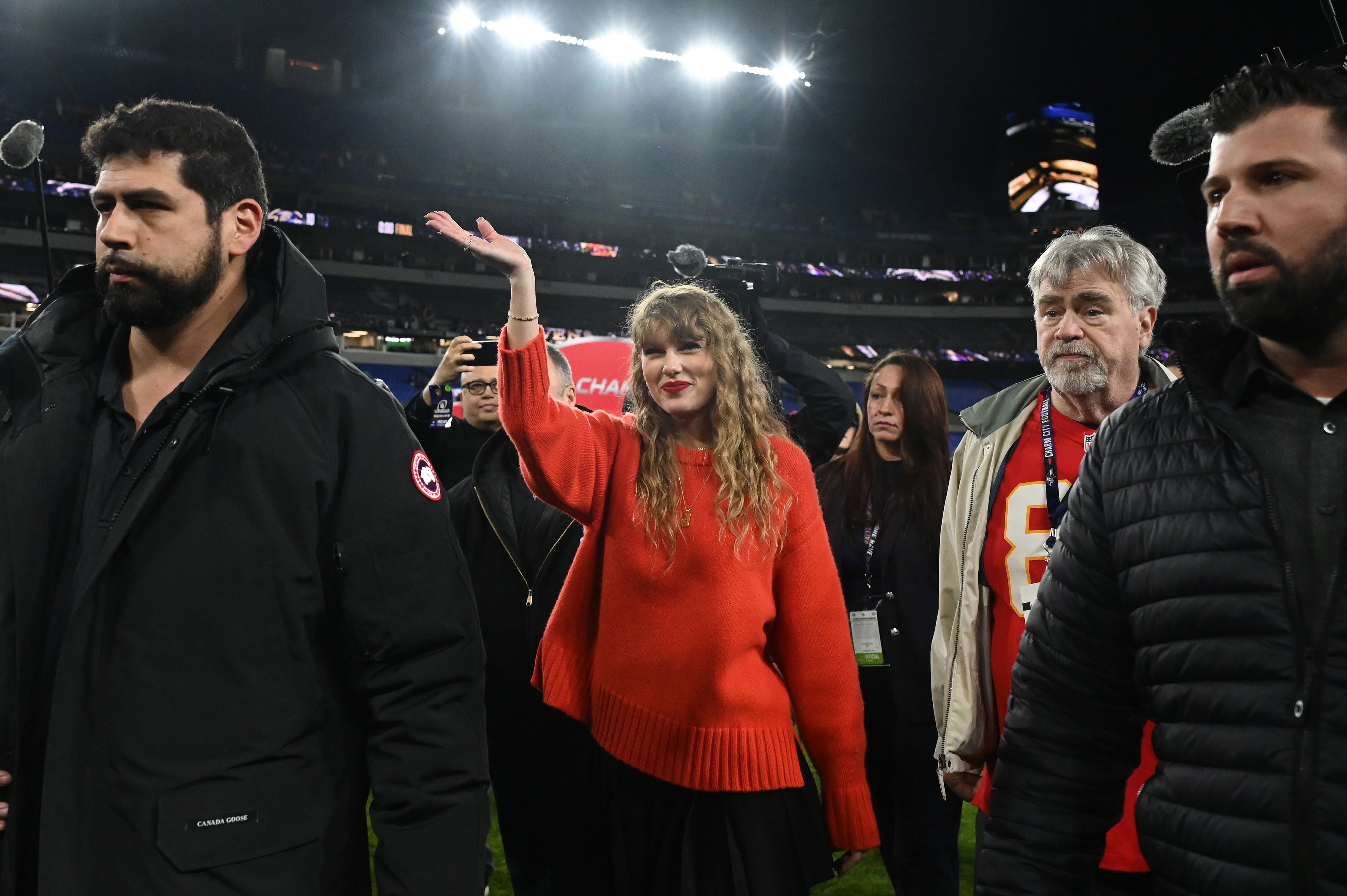 American singer-songwriter Taylor Swift walks off the field after the Kansas City Chiefs won the AFC Championship football game against the Baltimore Ravens at M&T Bank Stadium.