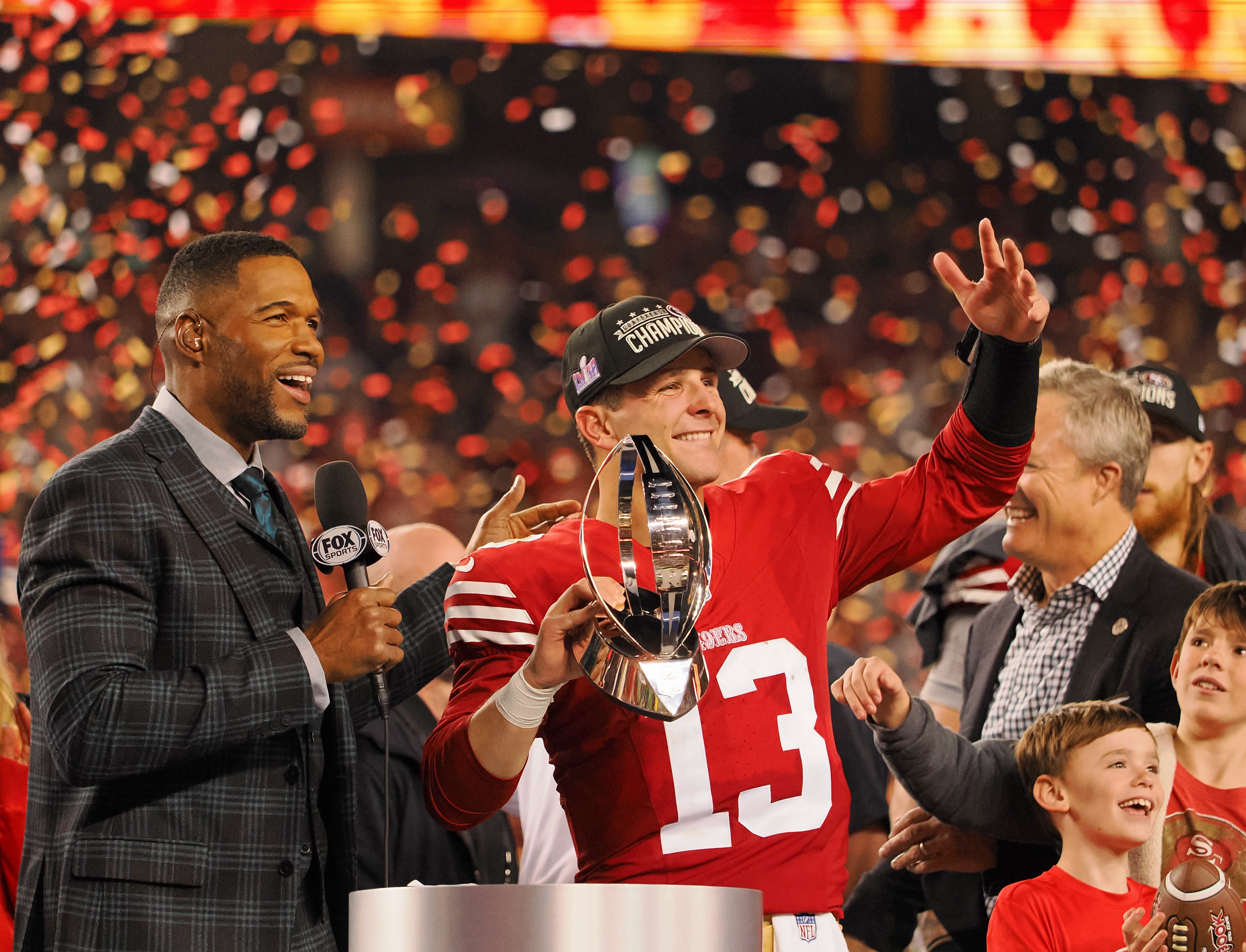 Jan 28, 2024; Santa Clara, California, USA; San Francisco 49ers quarterback Brock Purdy (13) holds the George Halas Trophy while after winning the NFC Championship football game against the Detroit Lions at Levi's Stadium.