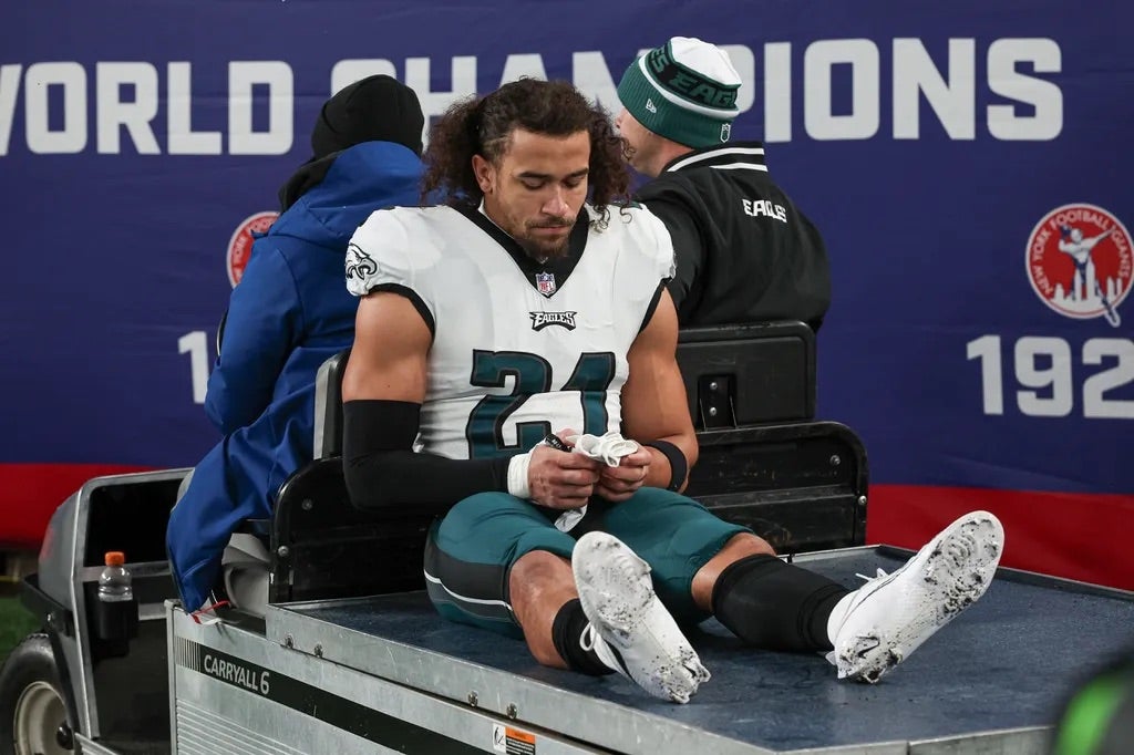 Philadelphia Eagles safety Sydney Brown (21) is carted off the field after an injury during the first half against the New York Giants at MetLife Stadium.
