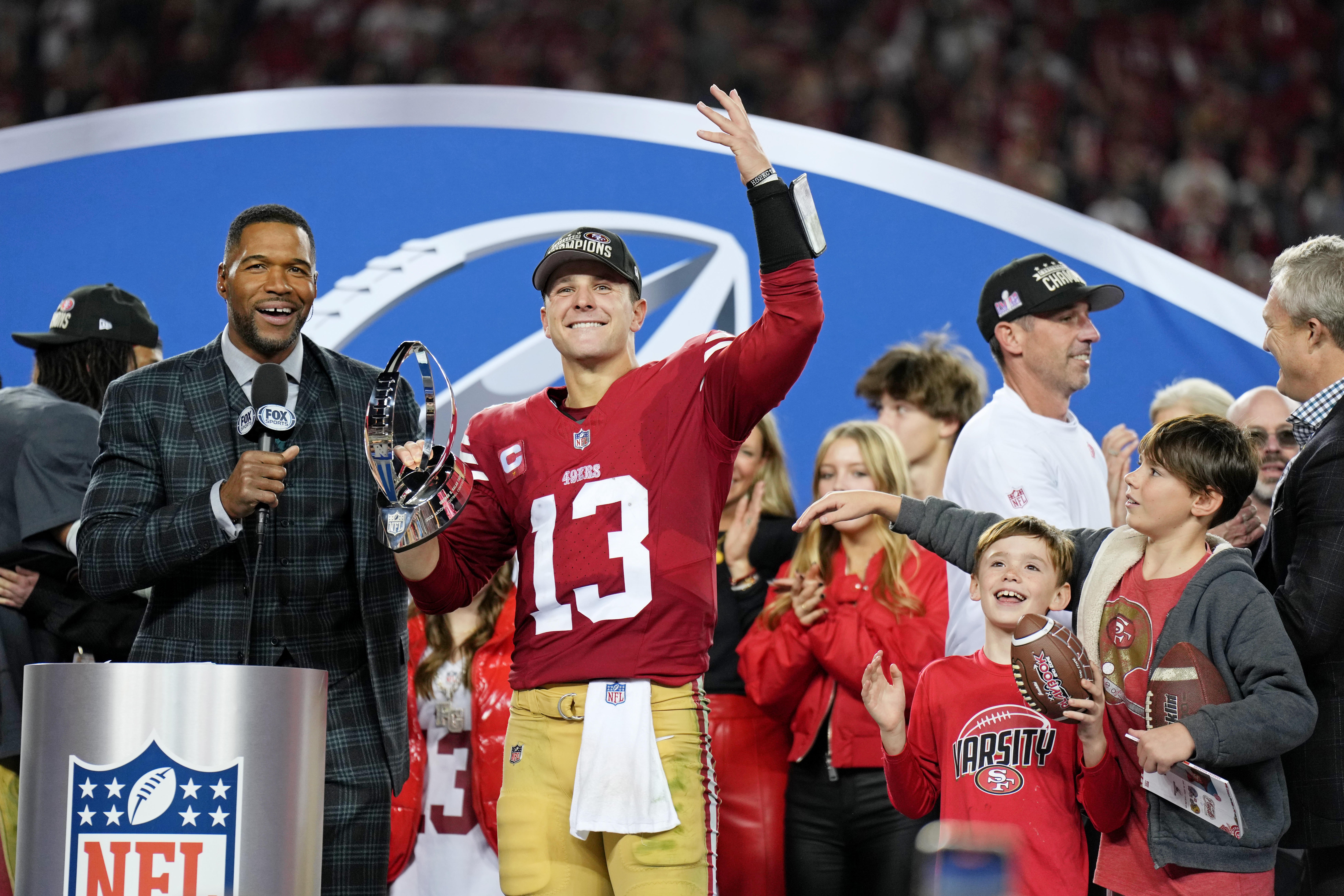 Jan 28, 2024; Santa Clara, California, USA; San Francisco 49ers quarterback Brock Purdy (13) celebrates with the George Halas Trophy after winning the NFC Championship football game against the Detroit Lions at Levi's Stadium.