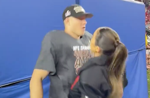 49ers' Christian Mccaffrey and his fiance Olivia Culpo chest bump following Super Bowl win over Detroit Lions.