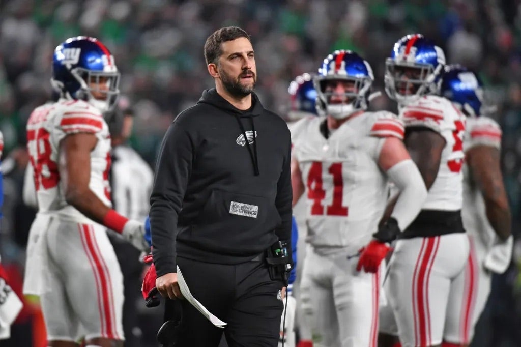 Philadelphia Eagles head coach Nick Sirianni walks onto the field to check on an injured player against the New York Giants at Lincoln Financial Field.