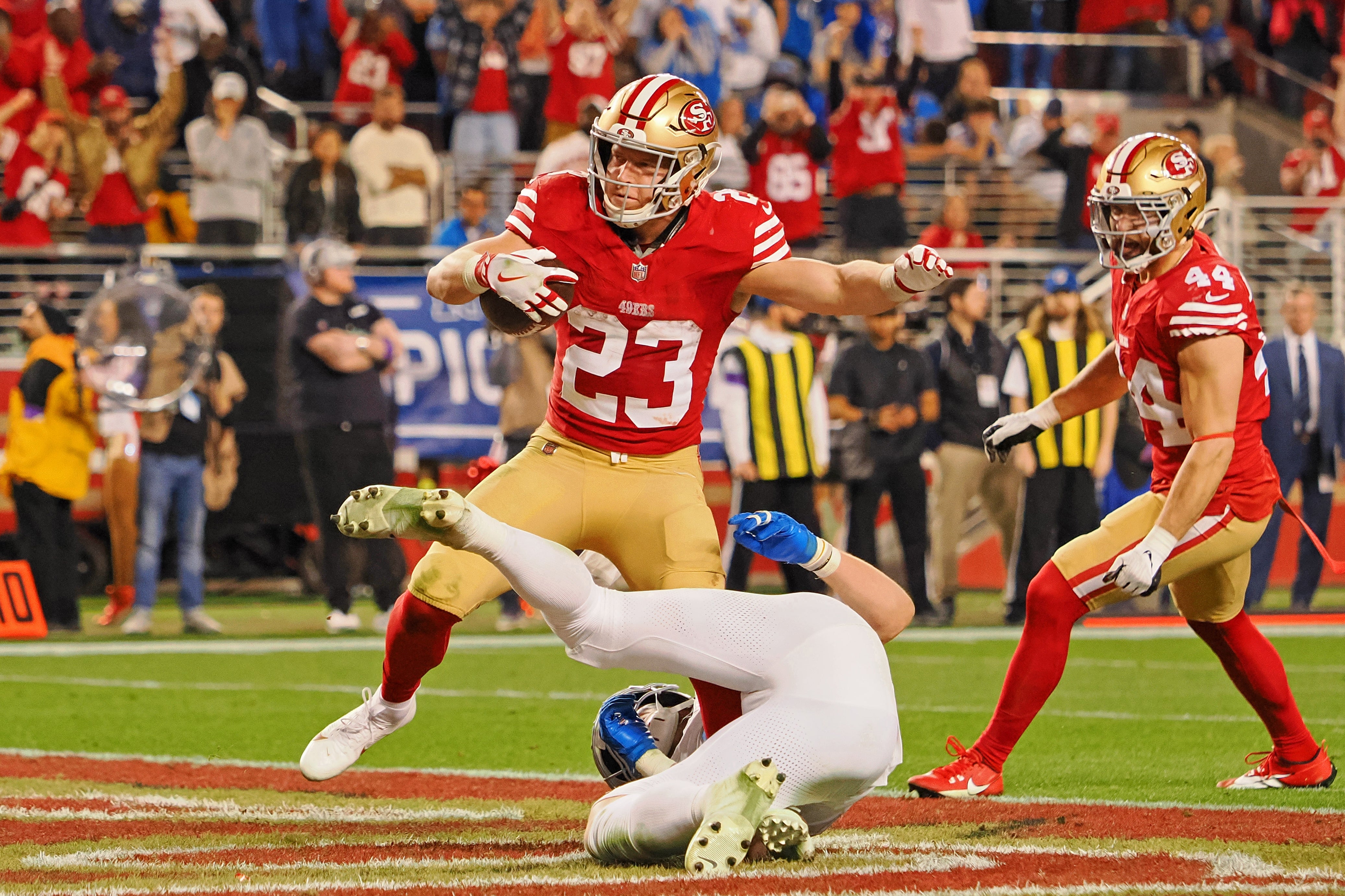 Jan 28, 2024; Santa Clara, California, USA; San Francisco 49ers running back Christian McCaffrey (23) runs with the ball for a touchdown against the Detroit Lions during the second half of the NFC Championship football game at Levi's Stadium.