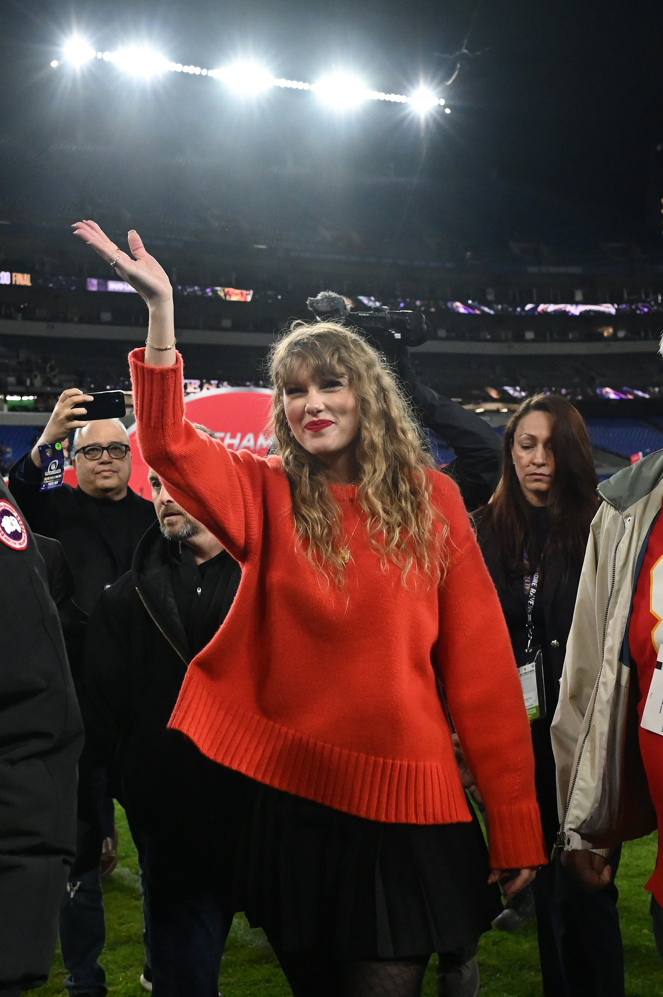 American singer-songwriter Taylor Swift walks off the field after the Kansas City Chiefs won the AFC Championship football game against the Baltimore Ravens at M&T Bank Stadium.