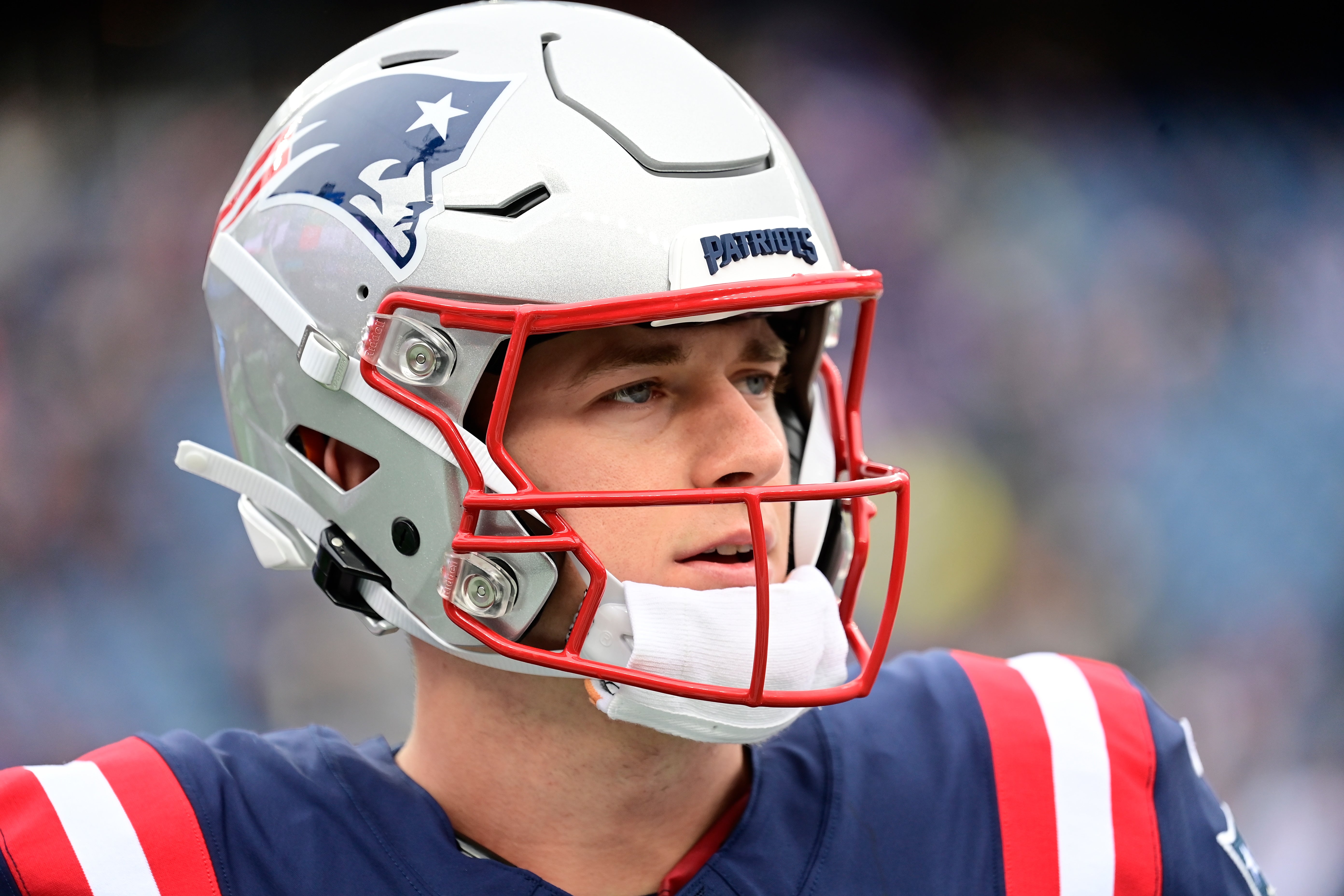 New England Patriots quarterback Mac Jones warms up before a game against the Kansas City Chiefs at Gillette Stadium