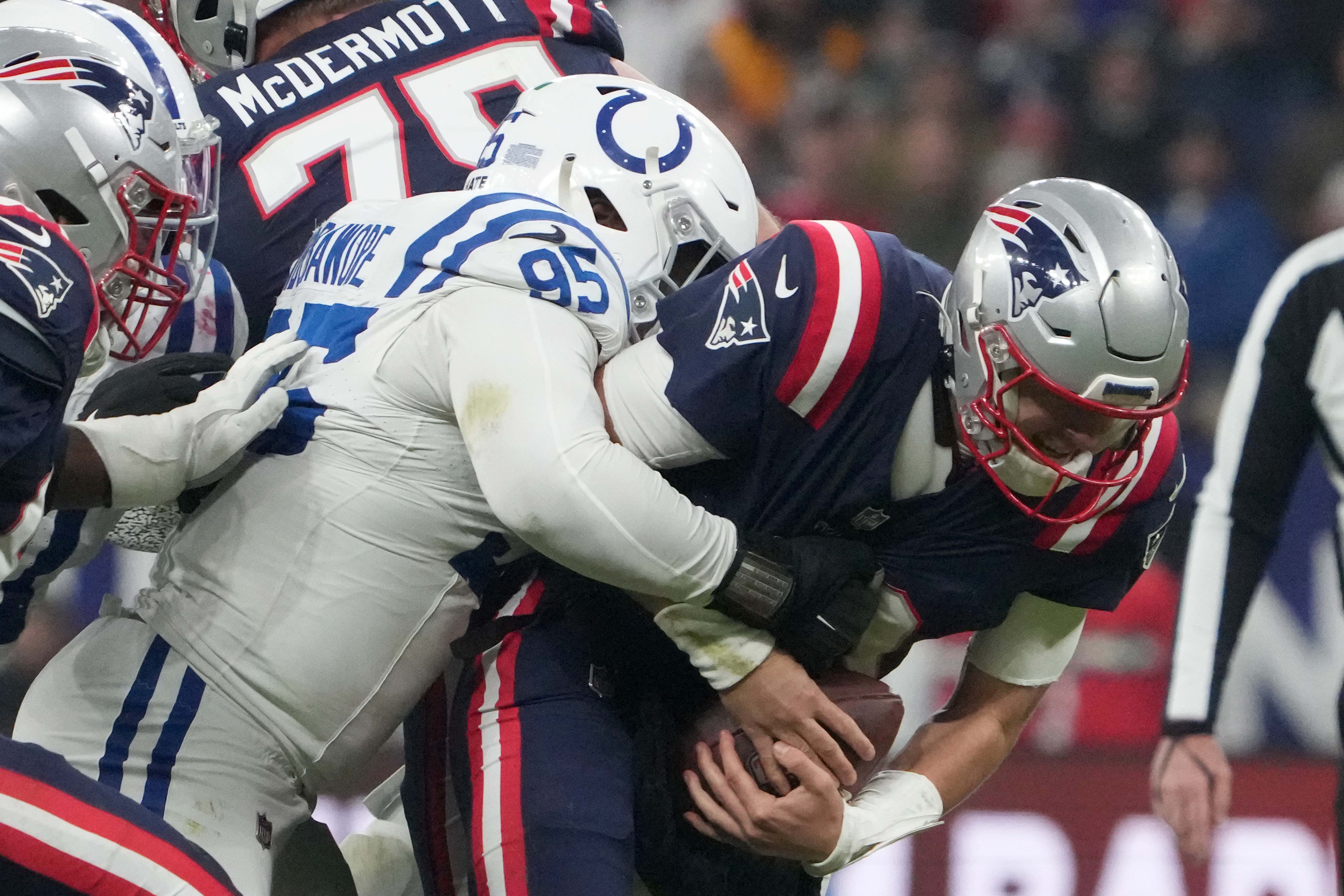 Indianapolis Colts defensive end Adetomiwa Adebawore pressures New England Patriots quarterback Mac Jones during the second half of an NFL International Series game at Deutsche Bank Park