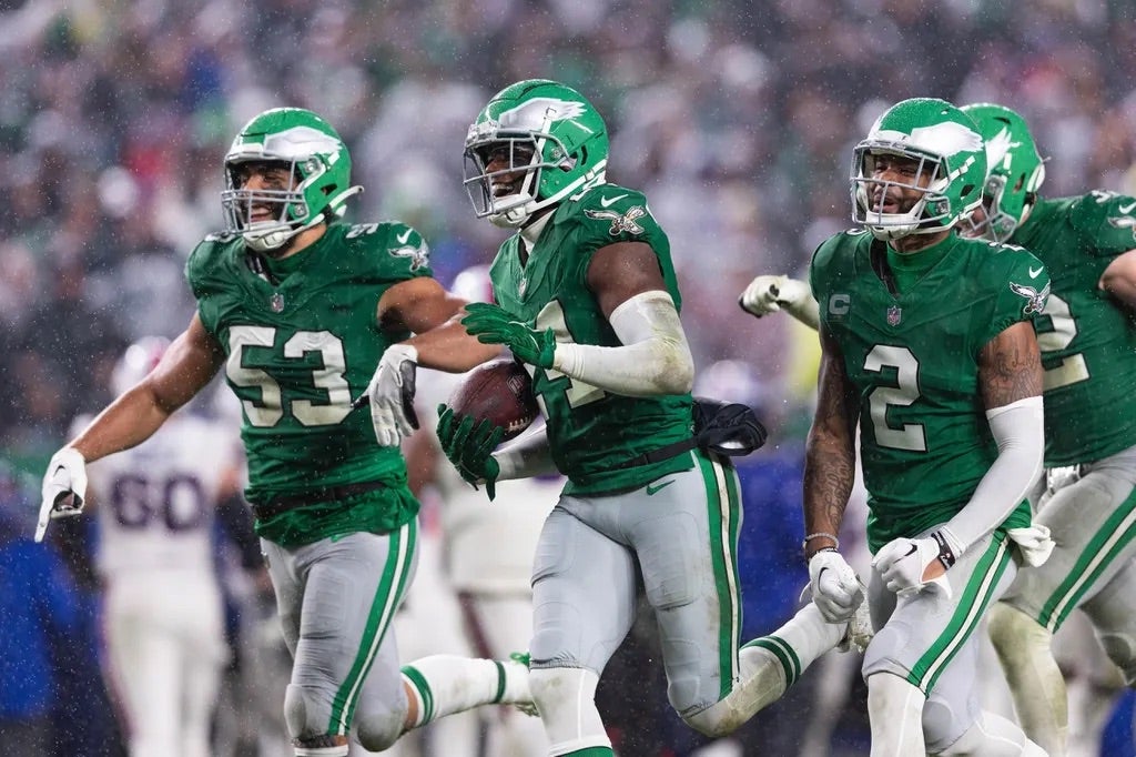 Philadelphia Eagles cornerback James Bradberry (24) celebrates with cornerback Darius Slay (2) and linebacker Christian Elliss (53) after his interception against the Buffalo Bills.