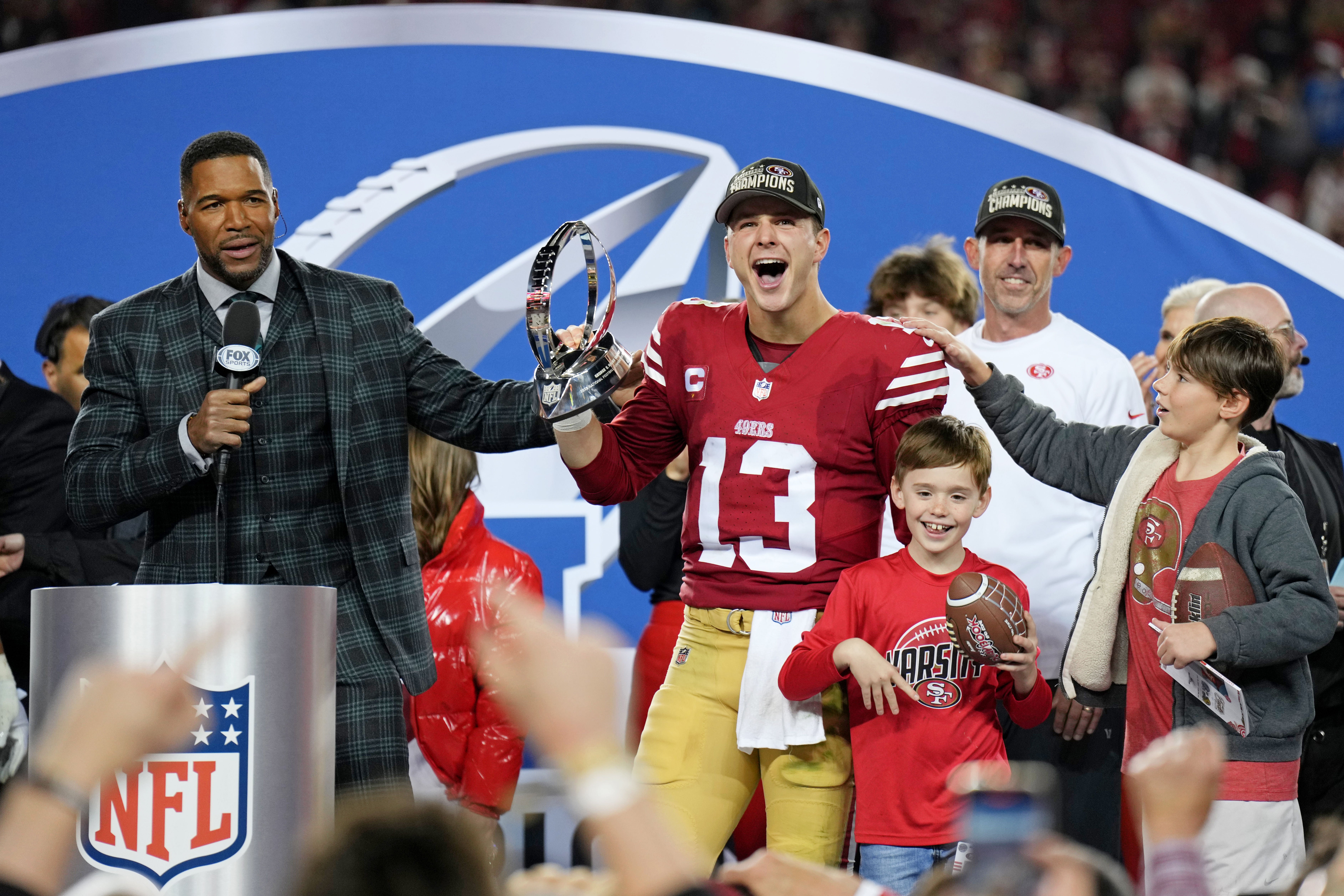 Jan 28, 2024; Santa Clara, California, USA; San Francisco 49ers quarterback Brock Purdy (13) celebrates with the George Halas Trophy after winning the NFC Championship football game against the Detroit Lions at Levi's Stadium.