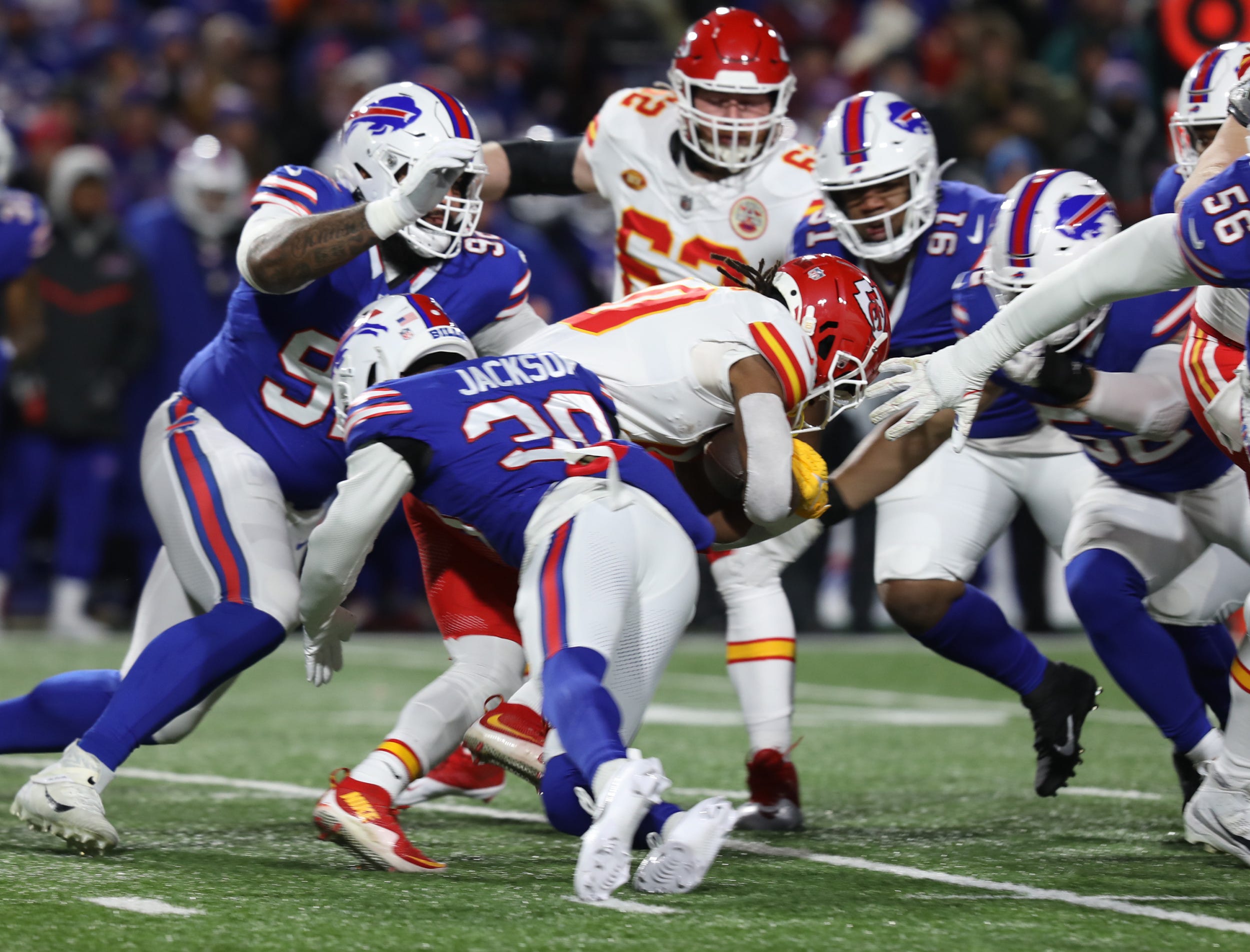 A whole bunch of Bills defensive players including Dane Jackson, DaQuan Jones, Ed Oliver and A.J. Klein come in to tackle Chiefs Isiah Pacheco during the first half of the Bills divisional game against Kansas City Chiefs at Highmark Stadium in Orchard Park on Jan. 21, 2024.