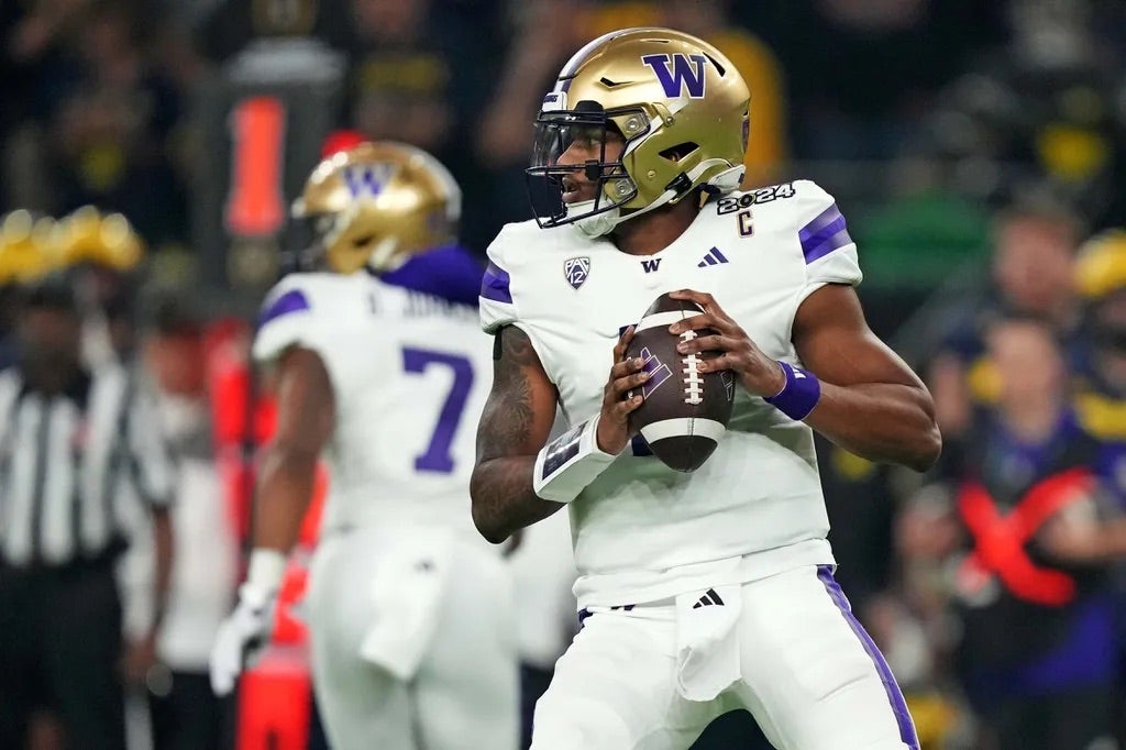 Washington Huskies quarterback Michael Penix Jr. (9) drops back to throws a pass during the second quarter against the Michigan Wolverines in the 2024 College Football Playoff national championship.