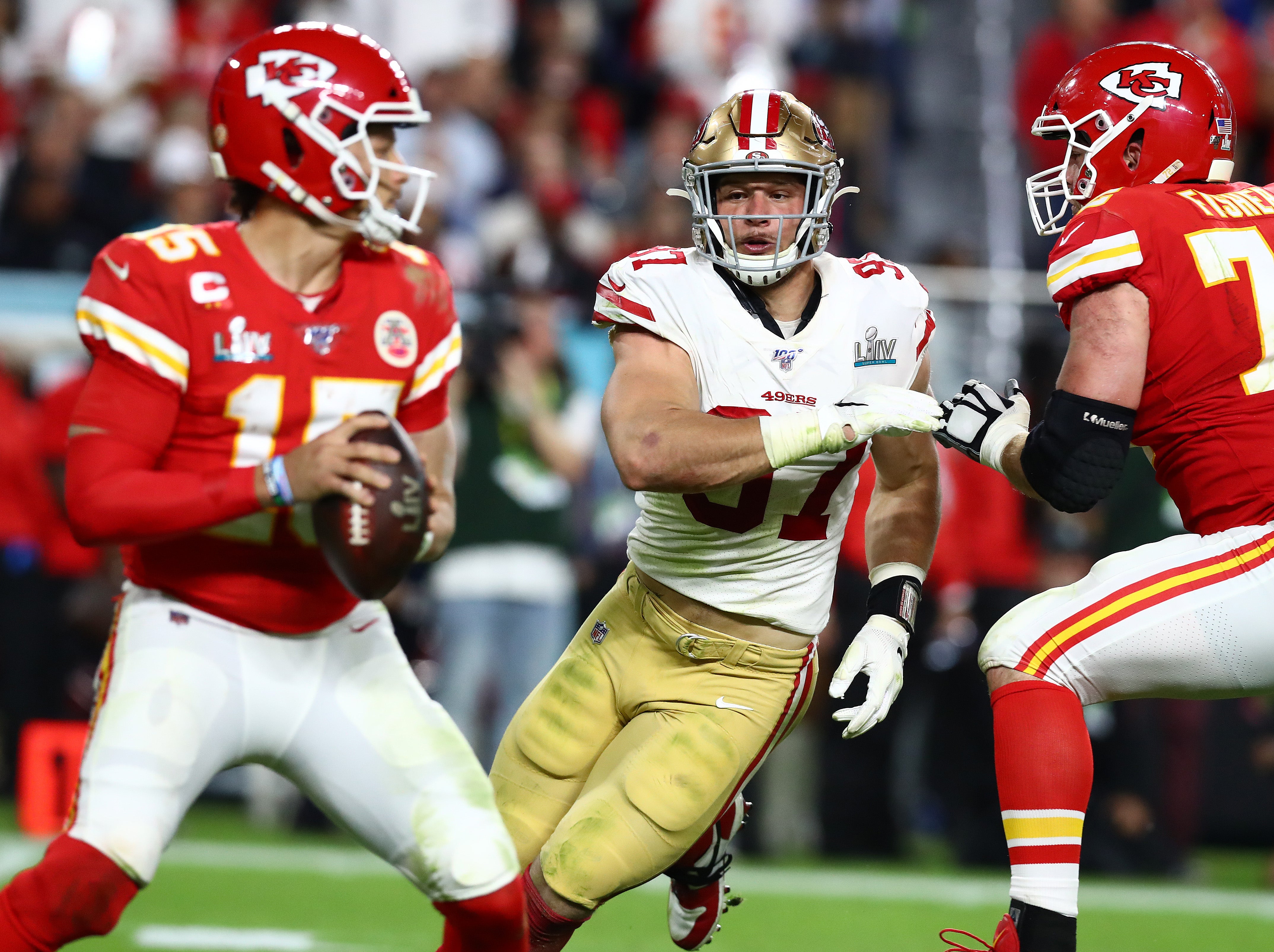 Feb 2, 2020; Miami Gardens, Florida, USA; San Francisco 49ers defensive end Nick Bosa (97) pressures Kansas City Chiefs quarterback Patrick Mahomes (15) in Super Bowl LIV at Hard Rock Stadium.