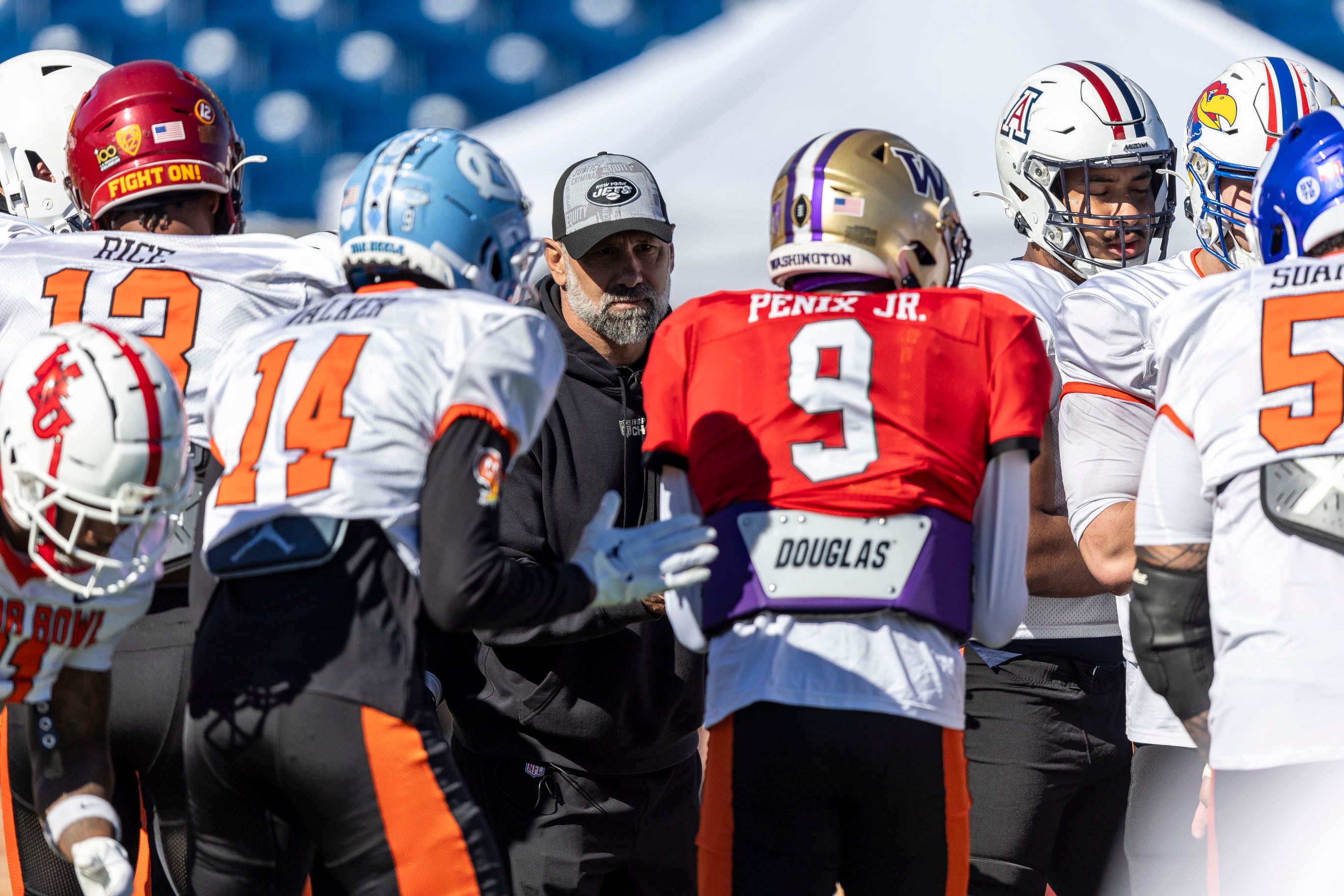 Jan 31, 2024; Mobile, AL, USA; National head coach Jeff Ulbrich of the New York Jets talks with his offensive players before a drill during practice for the National team at Hancock Whitney Stadium.