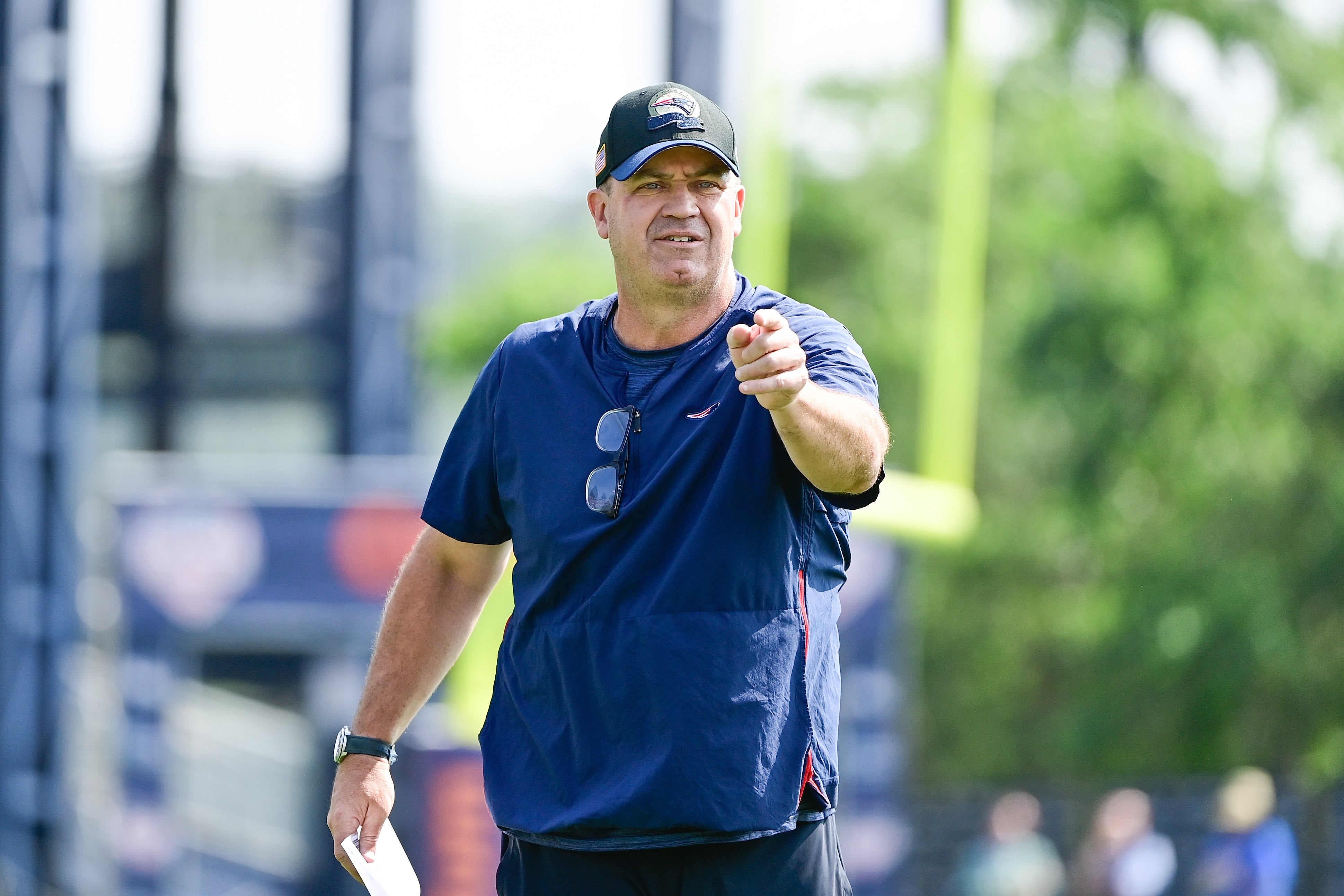 New England Patriots offensive coordinator/quarterbacks coach Bill O'Brien directs the office on a drill during training camp at Gillette Stadium.