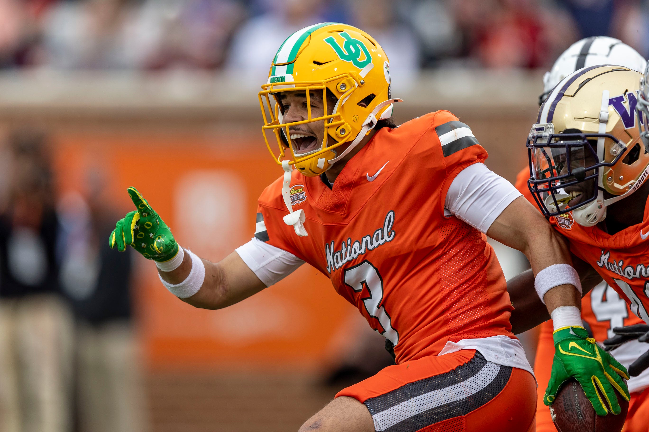 Feb 3, 2024; Mobile, AL, USA; National defensive back Evan Williams of Oregon (3) celebrates his interception during the first half of the 2024 Senior Bowl football game at Hancock Whitney Stadium.