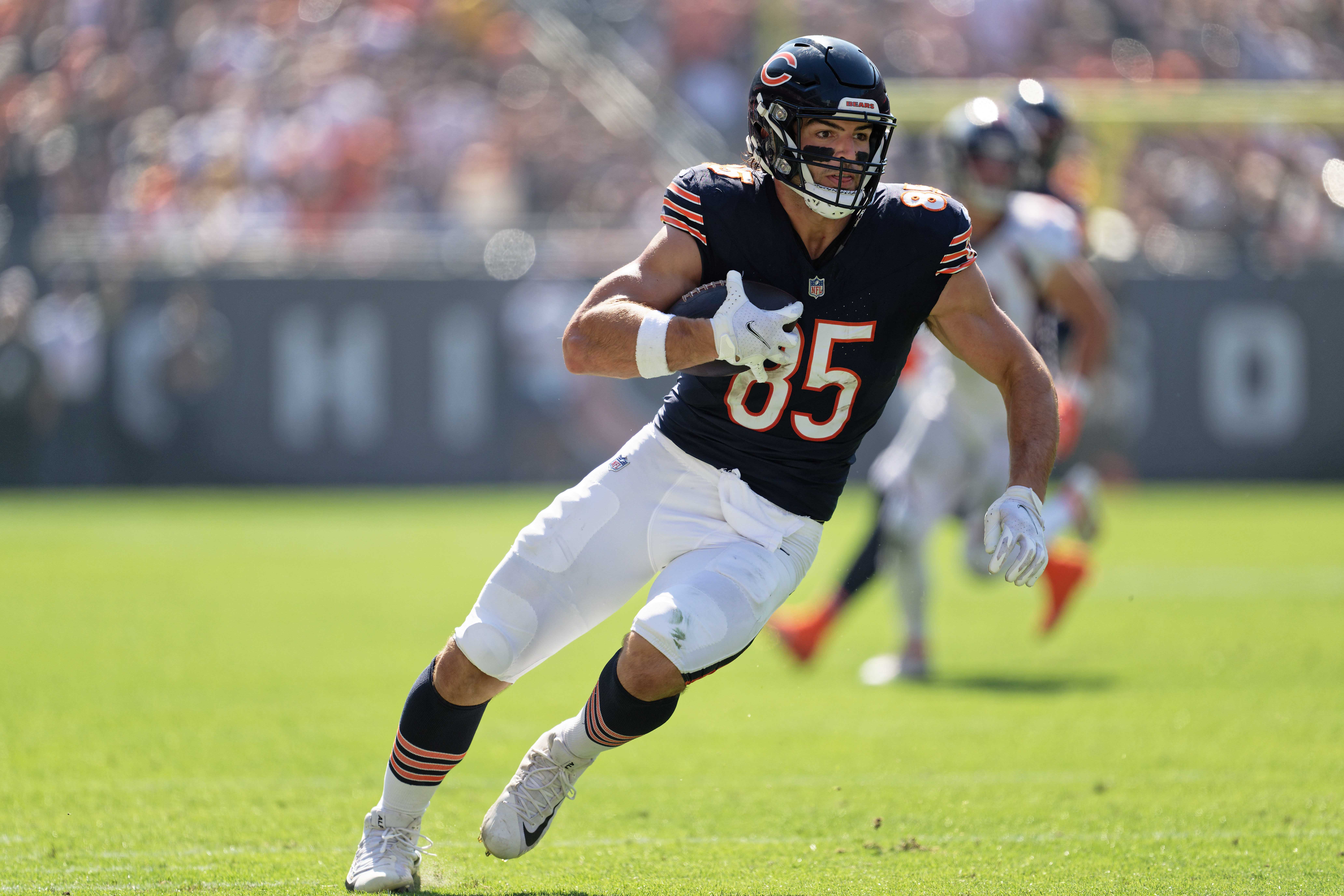 Oct 1, 2023; Chicago, Illinois, USA; Chicago Bears tight end Cole Kmet (85) runs with the ball against the Denver Broncos at Soldier Field.
