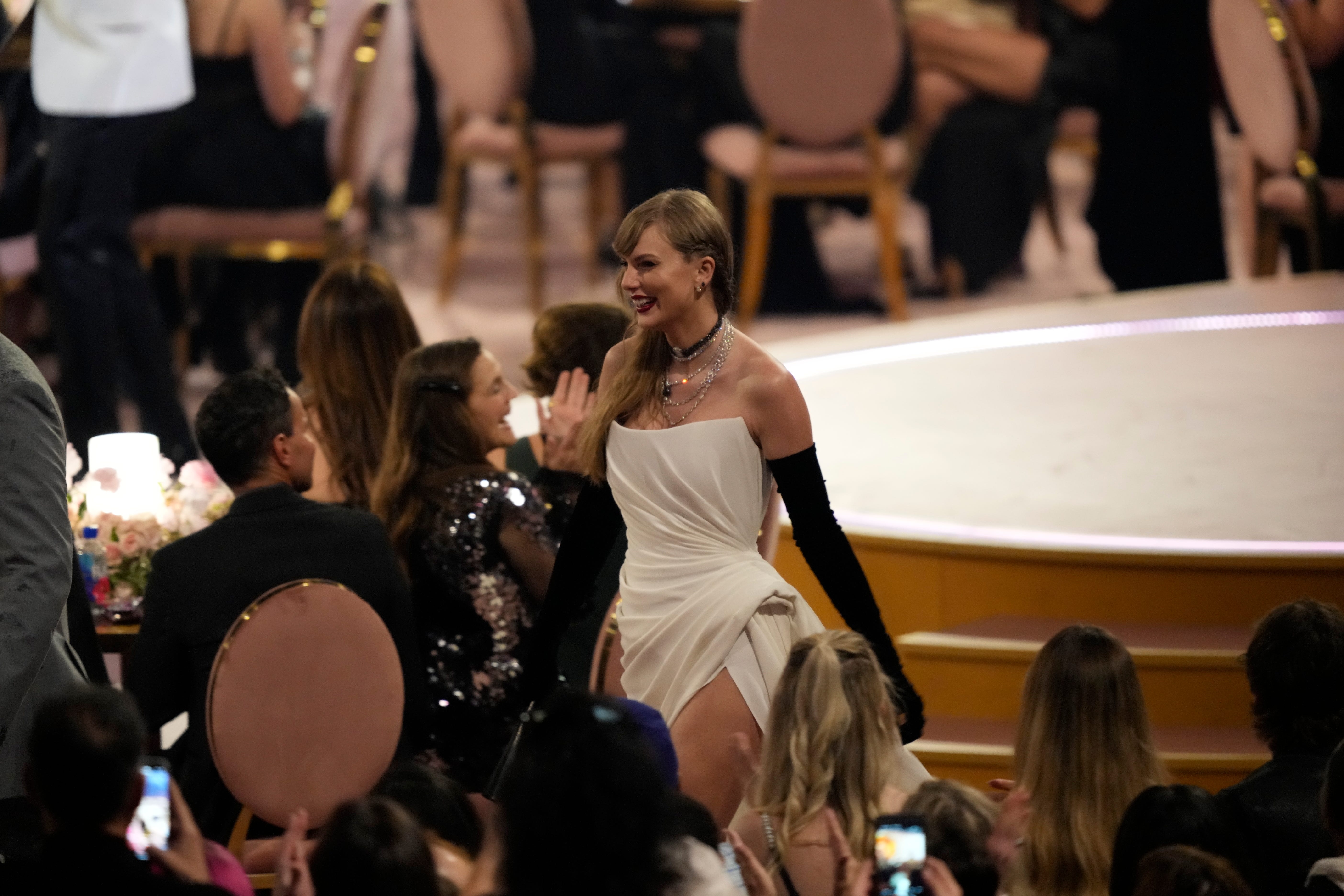 Taylor Swift walks through the audience during the 66th Annual Grammy Awards at Crypto.com Arena in Los Angeles on Sunday, Feb. 4, 2024.