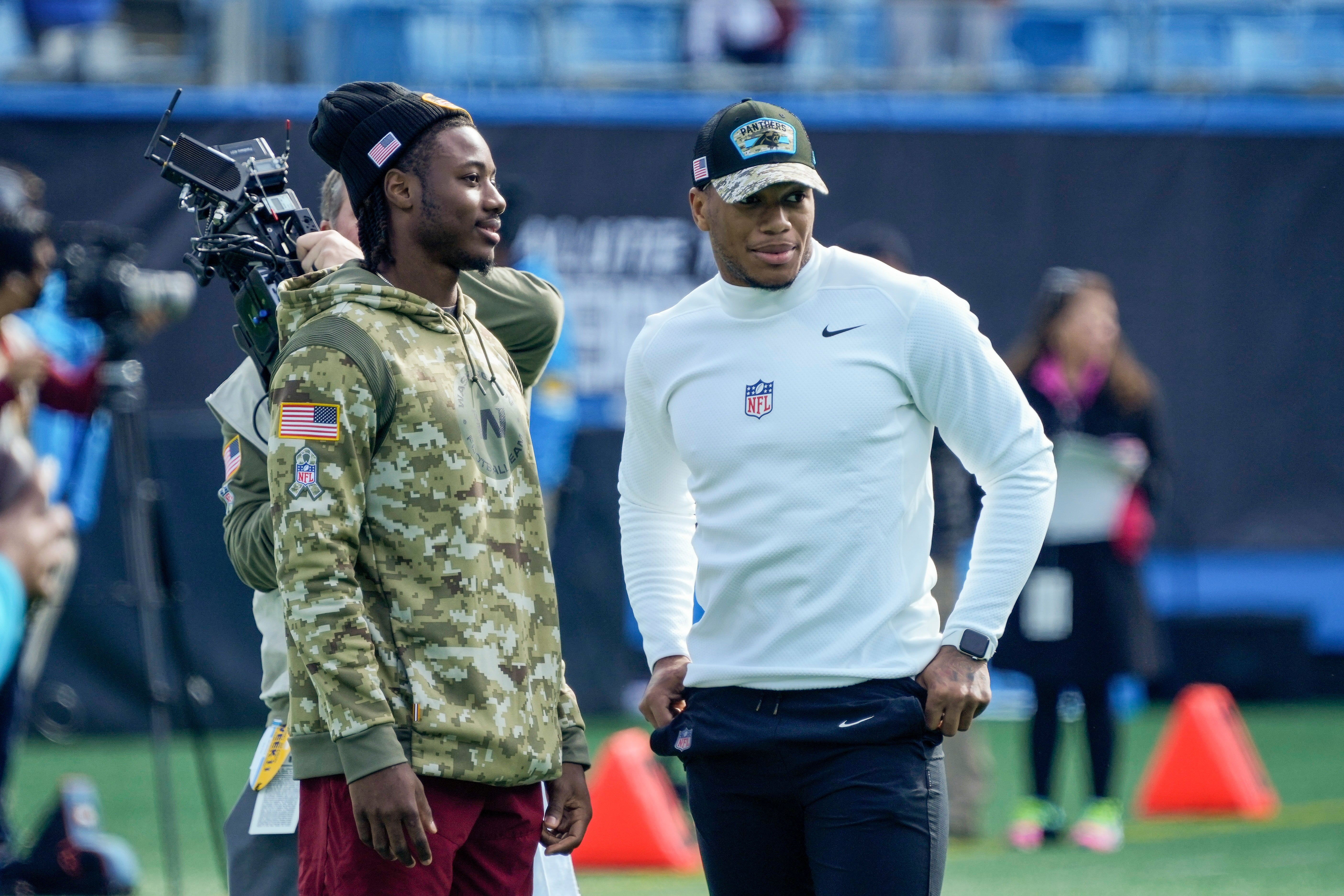 Nov 21, 2021; Charlotte, North Carolina, USA; Washington Football Team wide receiver Curtis Samuel (10) talks with Carolina Panthers wide receiver DJ Moore (2) during pregame warmups against the Washington Football Team at Bank of America Stadium.