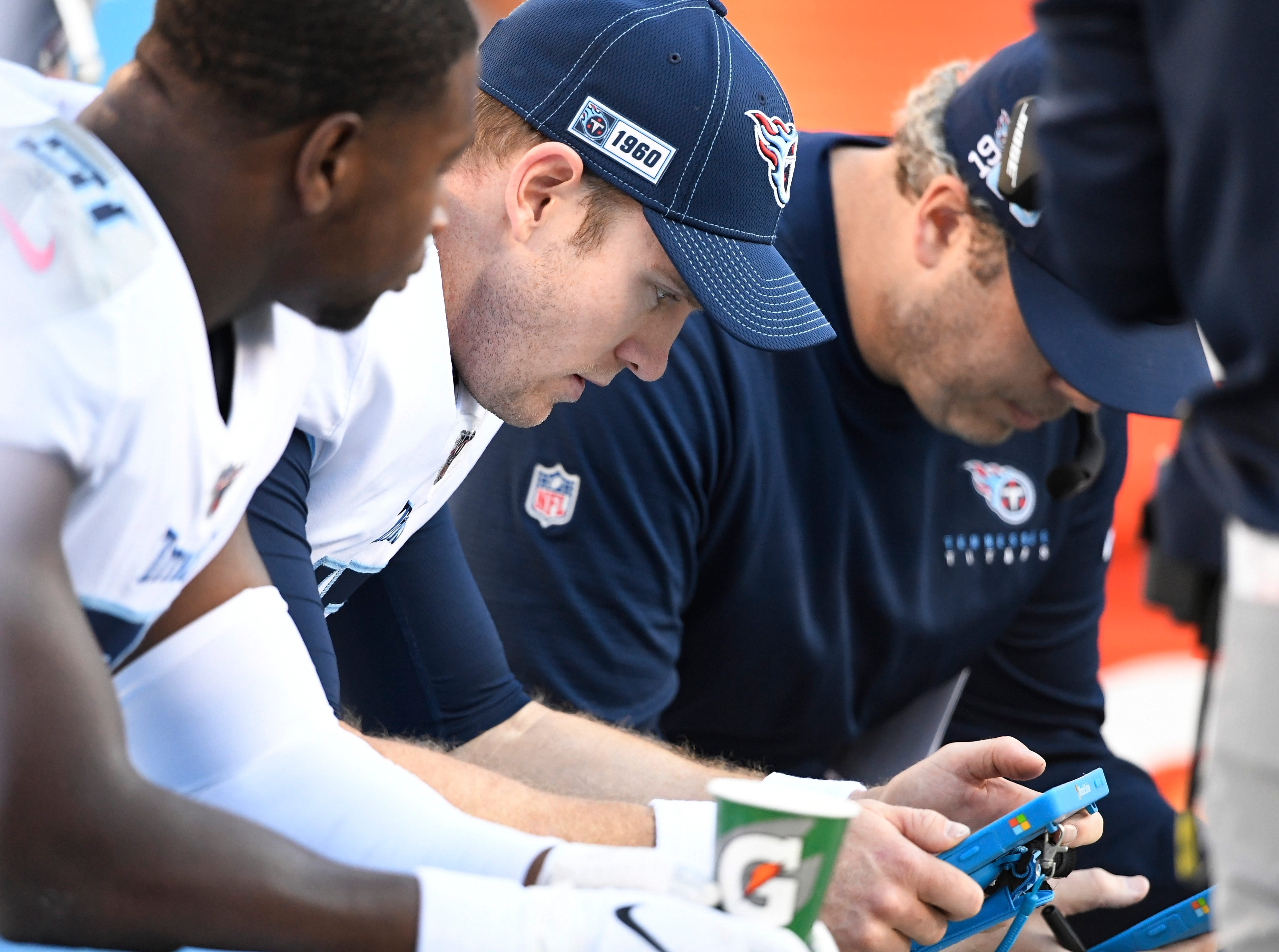 Tennessee Titans quarterback Ryan Tannehill (17) looks at a Microsoft Surface with offensive coordinator Arthur Smith during the fourth quarter at Bank of America Stadium Sunday, Nov. 3, 2019 in Charlotte, N.C. Gw52474