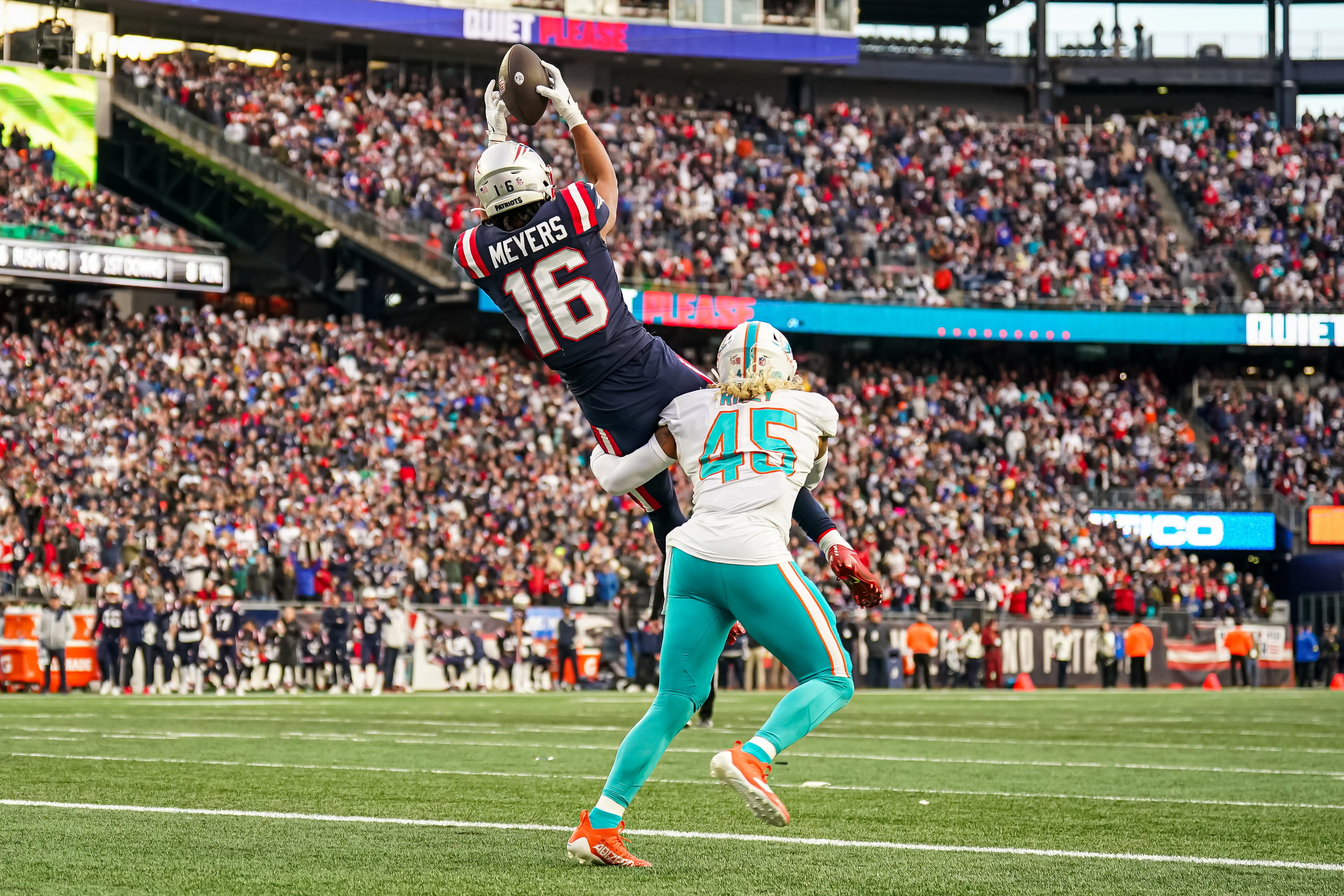 New England Patriots wide receiver Jakobi Meyers makes the touchdown against Miami Dolphins linebacker Duke Riley in the second half at Gillette Stadium.
