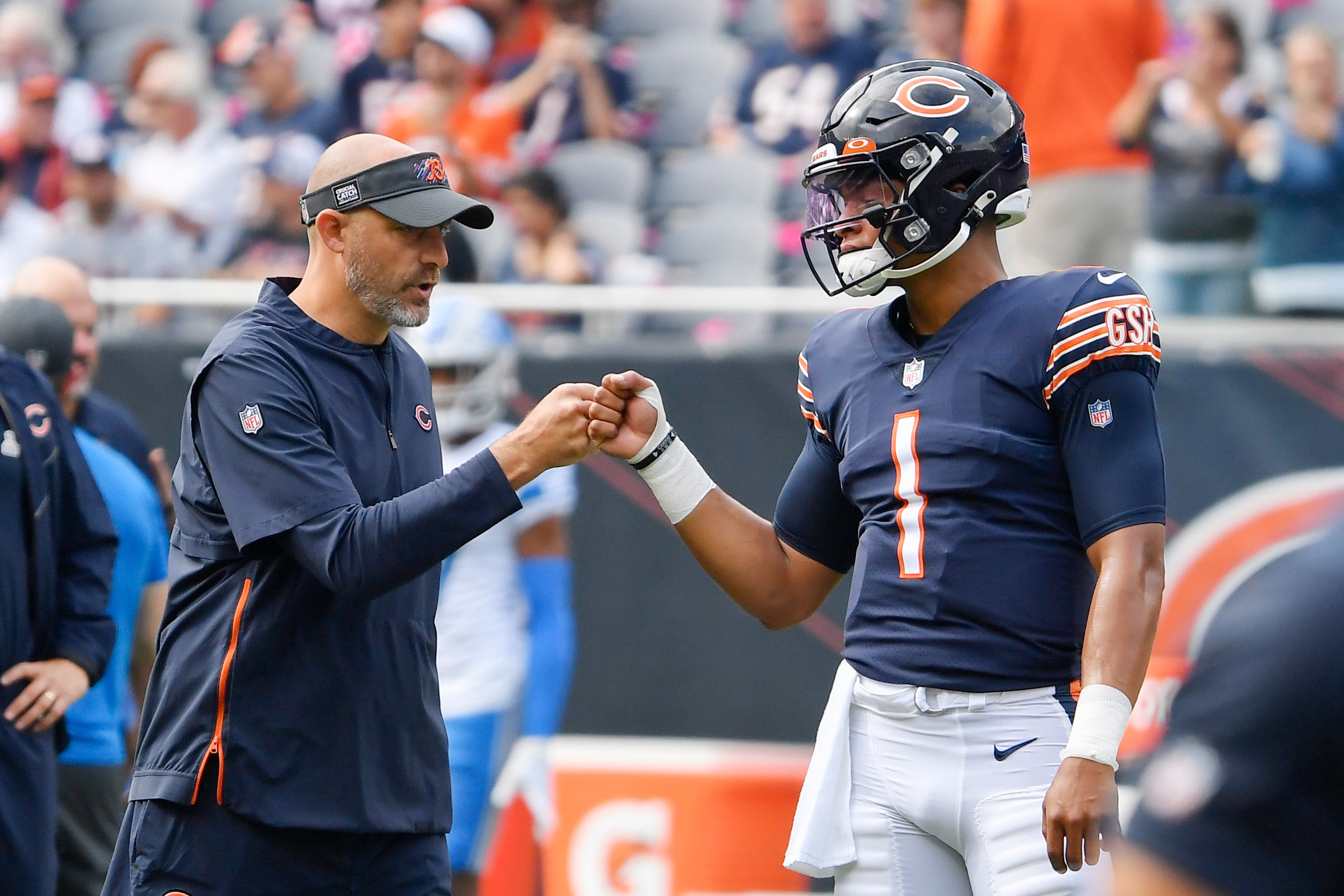Oct 3, 2021; Chicago, Illinois, USA; Chicago Bears head coach Matt Nagy and Chicago Bears quarterback Justin Fields (1) shake hands before the game against the Detroit Lions at Soldier Field.