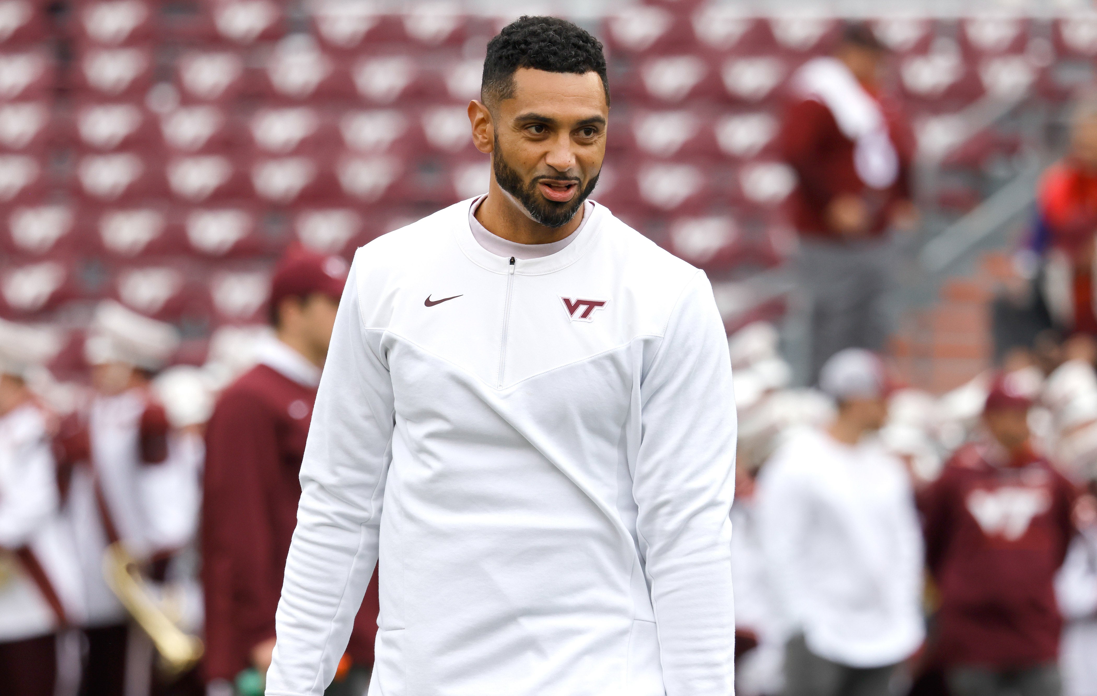 Oct 16, 2021; Blacksburg, Virginia, USA; Virginia Tech Hokies defensive Coordinator Justin Hamilton watches warmups before the game against the Pittsburgh Panthers at Lane Stadium.