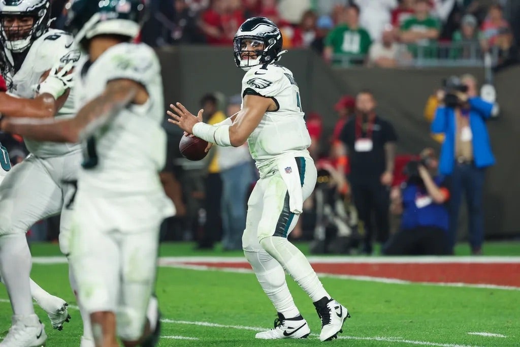 Philadelphia Eagles quarterback Jalen Hurts (1) throws against the Tampa Bay Buccaneers during the second half of a 2024 NFC wild card game at Raymond James Stadium.