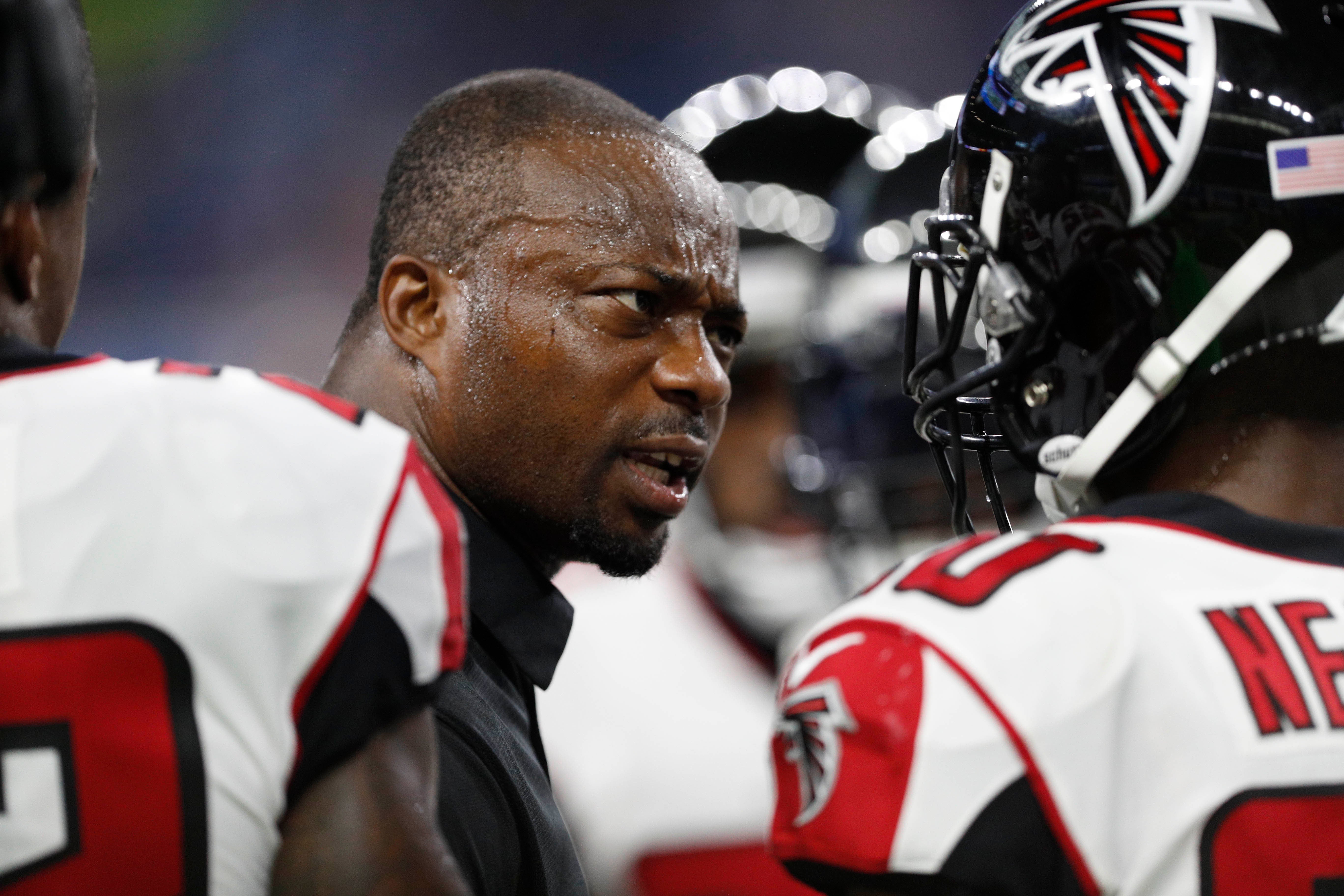 Atlanta Falcons defensive coordinator Marquand Manuel gives a pep talk to his team before the game against the Detroit Lions at Ford Field.