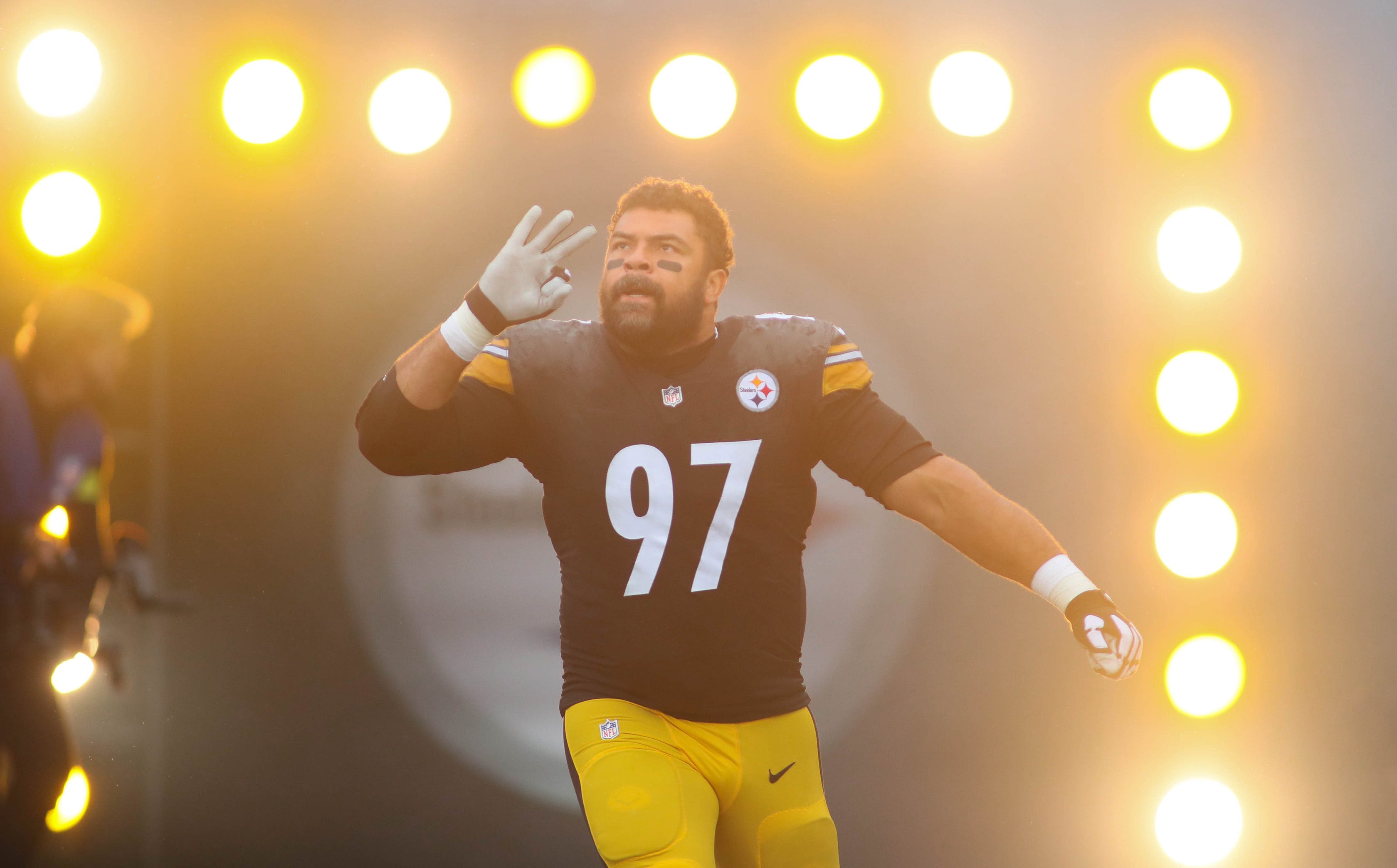 Cameron Heyward (97) of the Pittsburgh Steelers runs out of the tunnel after being introduced prior to the start of the game against the New York Jets at Acrisure Stadium in Pittsburgh, PA on October 2, 2022. Pittsburgh Steelers Vs New York Jets Week 4