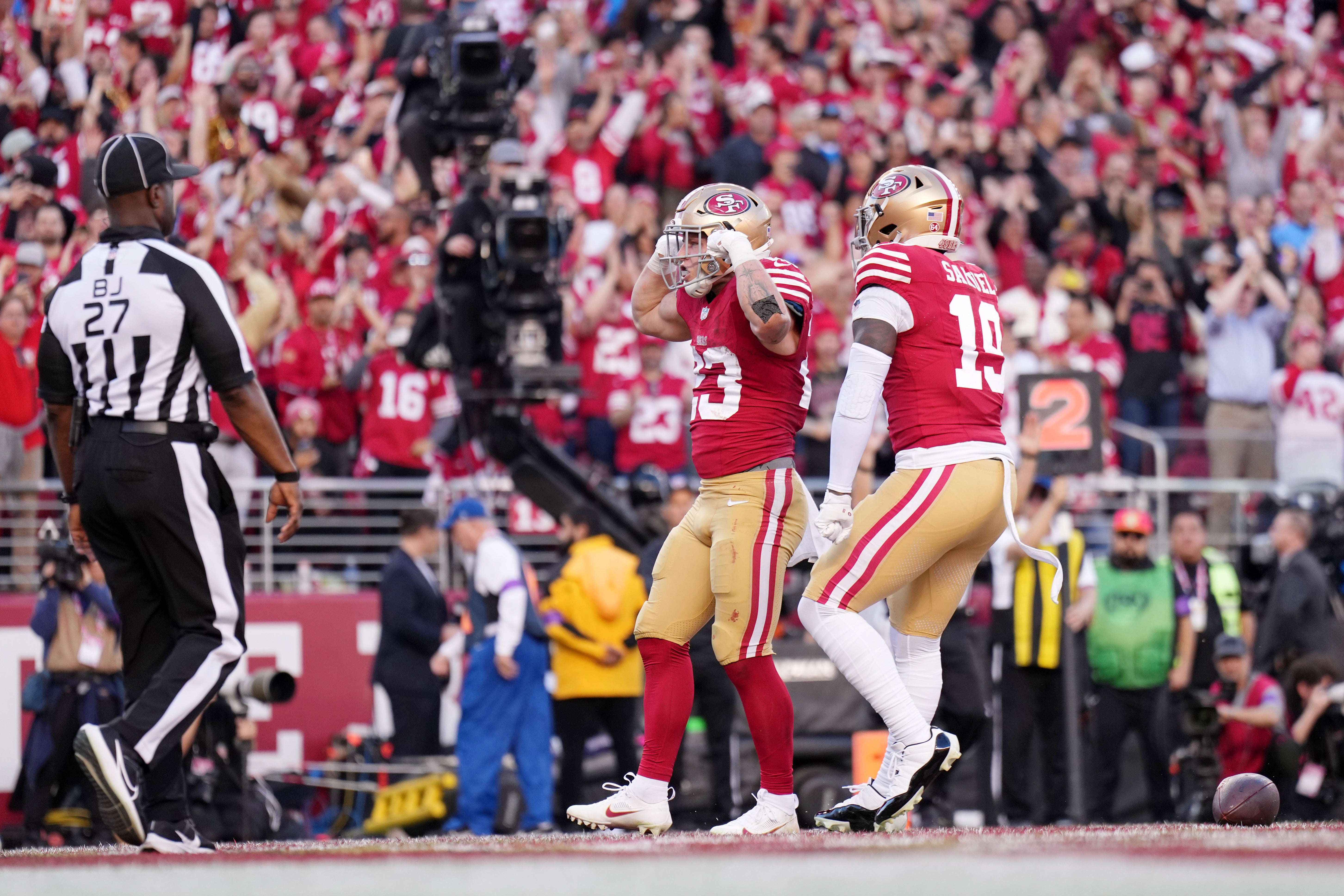 Jan 28, 2024; Santa Clara, California, USA; San Francisco 49ers running back Christian McCaffrey (23) celebrates after scoring a touchdown against the Detroit Lions during the first half of the NFC Championship football game at Levi's Stadium.