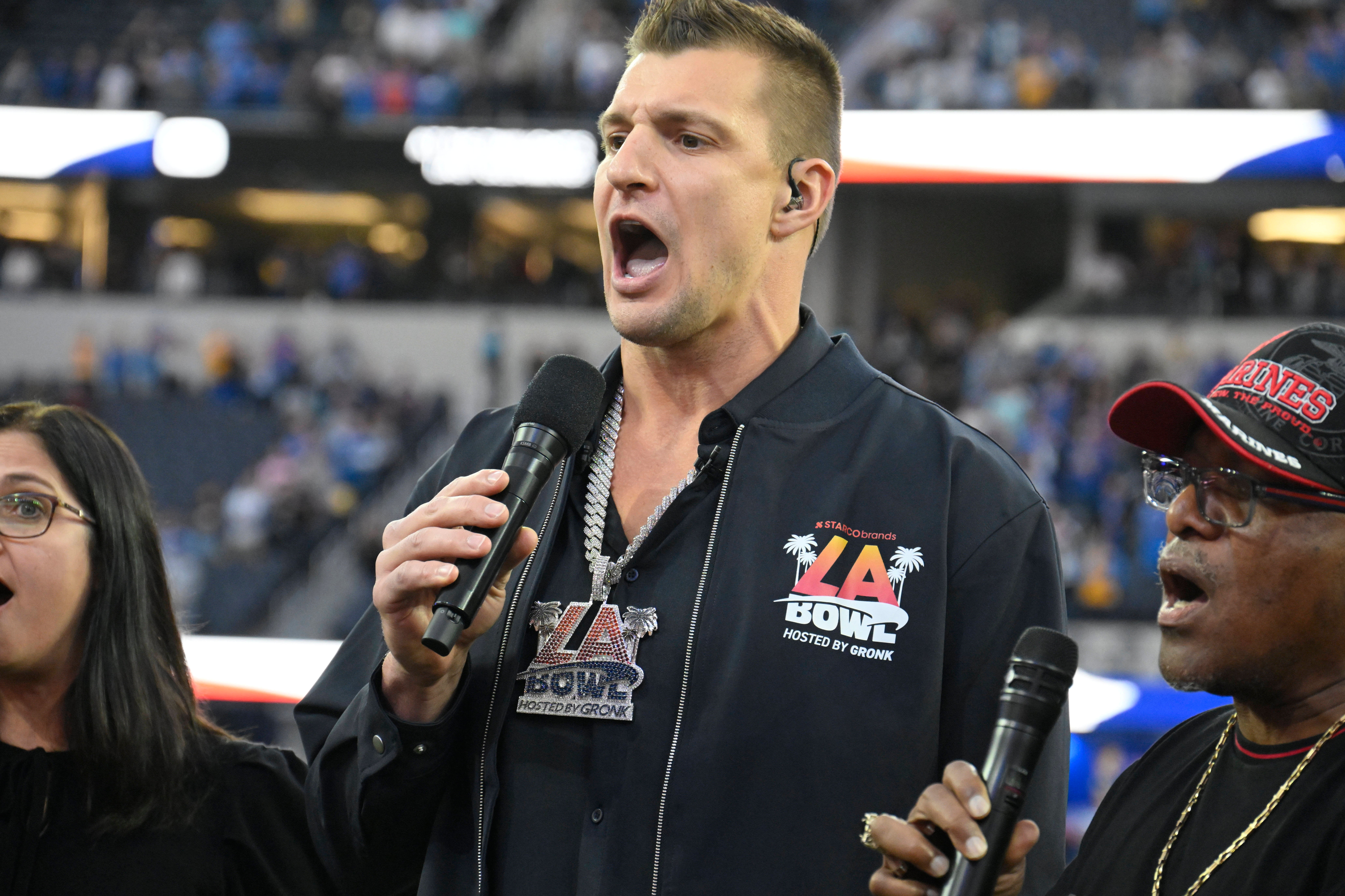 Rob Gronkowski sings the during the National Anthem with the New Directions Veterans Choir before the Starco Brands LA Bowl at SoFi Stadium. Gronkowski is the host of the game.