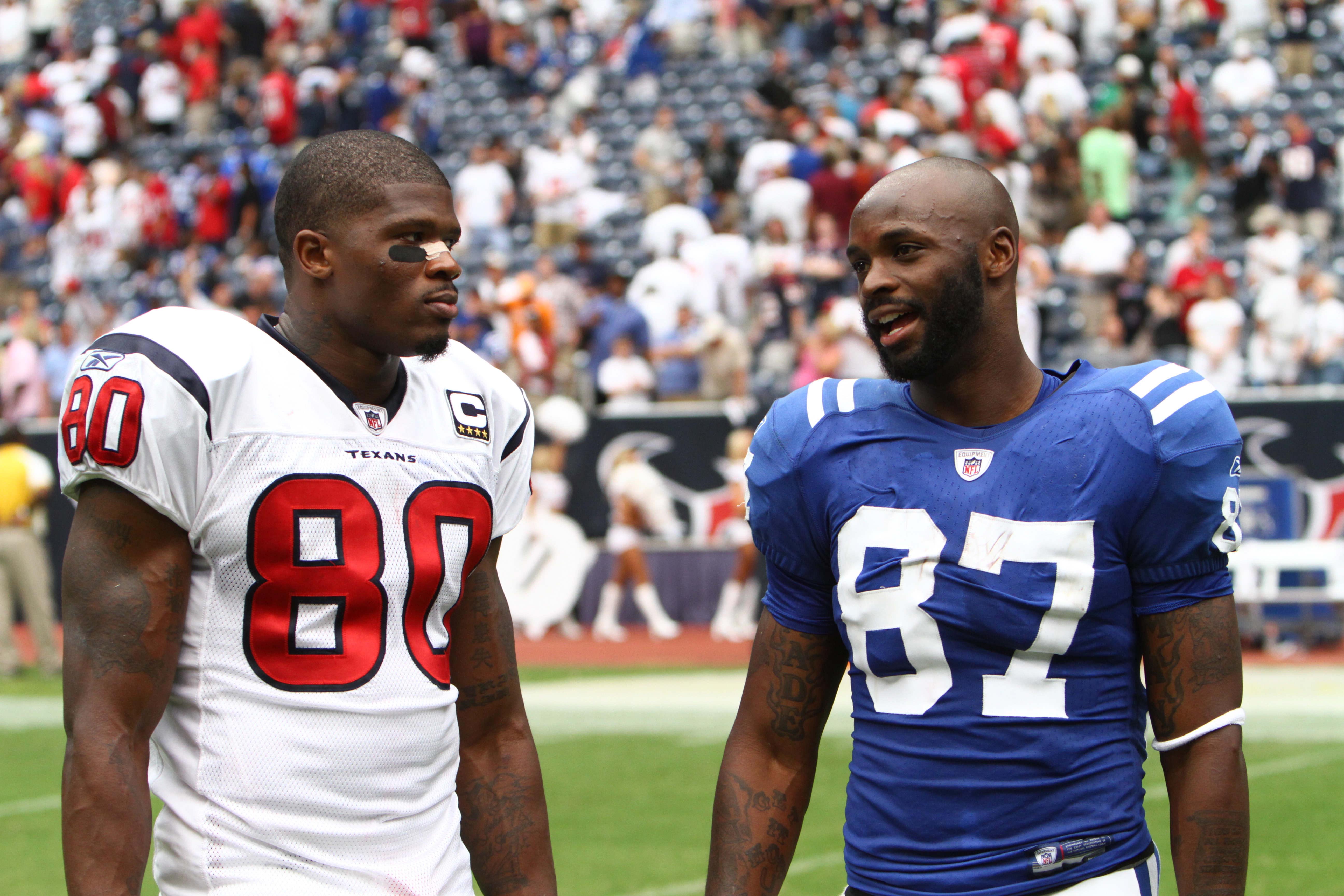 Sept 12, 2010; Houston, TX, USA; Houston Texans wide receiver Andre Johnson (80) and Indianapolis Colts wide receiver Reggie Wayne (87) talk after the game at Reliant Stadium. The Texans won 34-24.