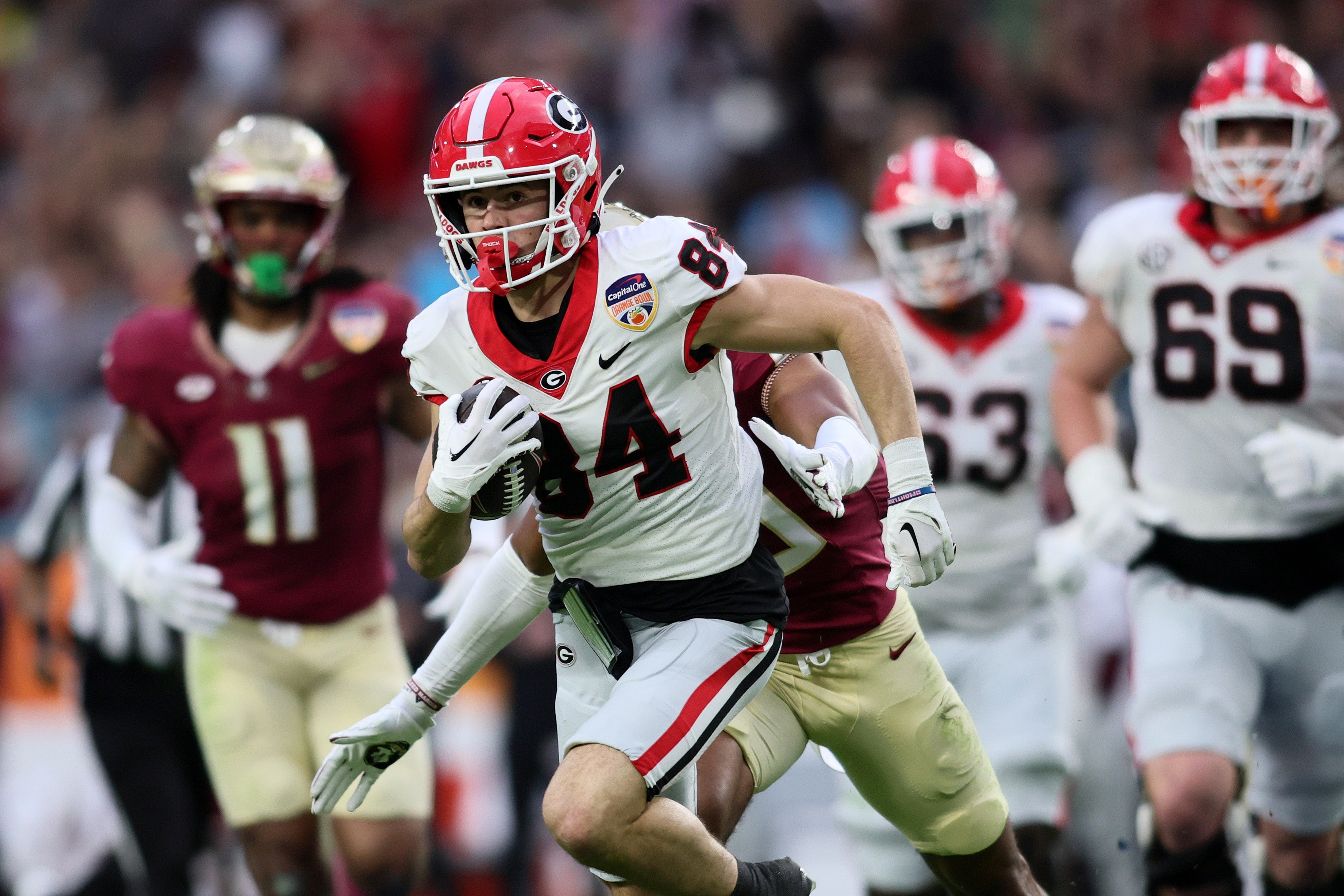 Dec 30, 2023; Miami Gardens, FL, USA; Georgia Bulldogs wide receiver Ladd McConkey (84) makes a catch and runs for touchdown against the Florida State Seminoles during the first half in the 2023 Orange Bowl at Hard Rock Stadium. Mandatory Credit: Sam Navarro-USA TODAY Sports