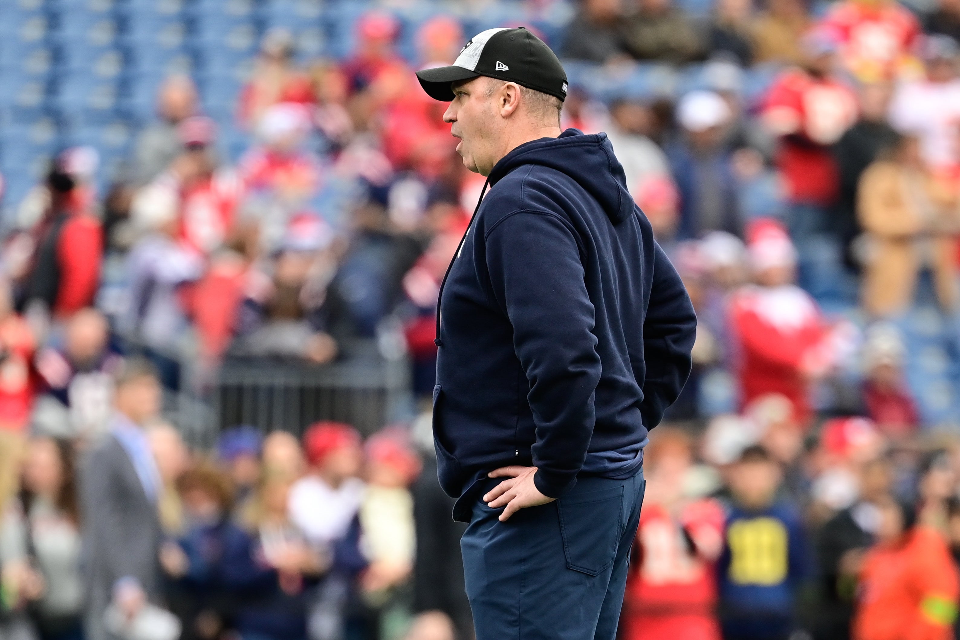 New England Patriots offensive coordinator Bill O'Brien watches the team warm up before a game against the Kansas City Chiefs at Gillette Stadium
