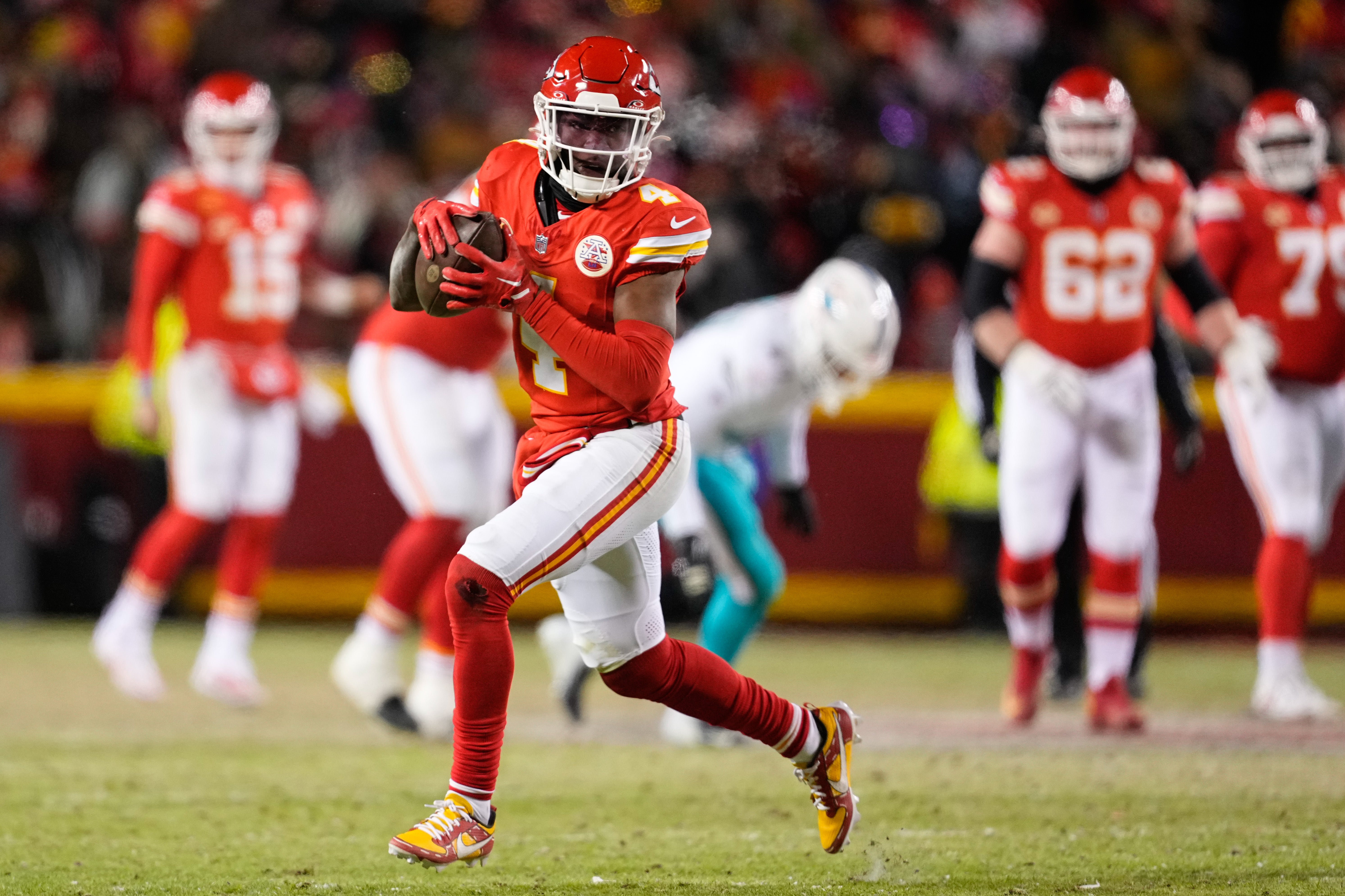 Kansas City Chiefs wide receiver Rashee Rice (4) runs the ball against the Miami Dolphins during the second half of the 2024 AFC wild card game at GEHA Field at Arrowhead Stadium.