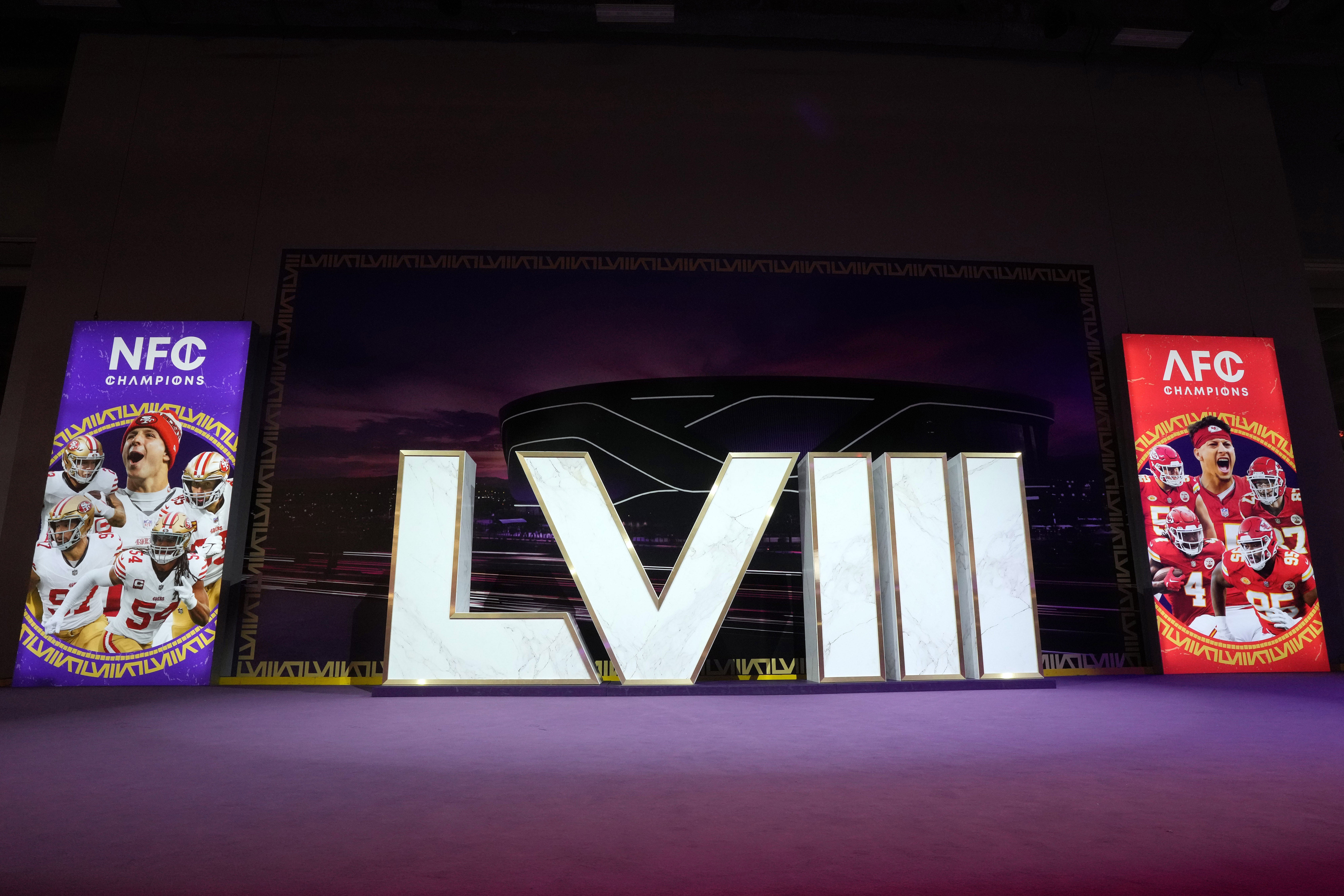 Feb 9, 2024; Las Vegas, NV, USA; The Super Bowl 58 roman numerals at the NFL Experience with images of San Francisco 49ers running back Christian McCaffrey (23), quarterback Brock Purdy (13), tight end George Kittle (85), defensive end Nick Bosa (97) and linebacker Fred Warner (54) and Kansas City Chiefs center Creed Humphrey (52), quarterback Patrick Mahomes (15), tight end Travis Kelce (87), wide receiver Rashee Rice (4) and defensive tackle Chris Jones (95) at the Mandalay Bay South Convention Center.