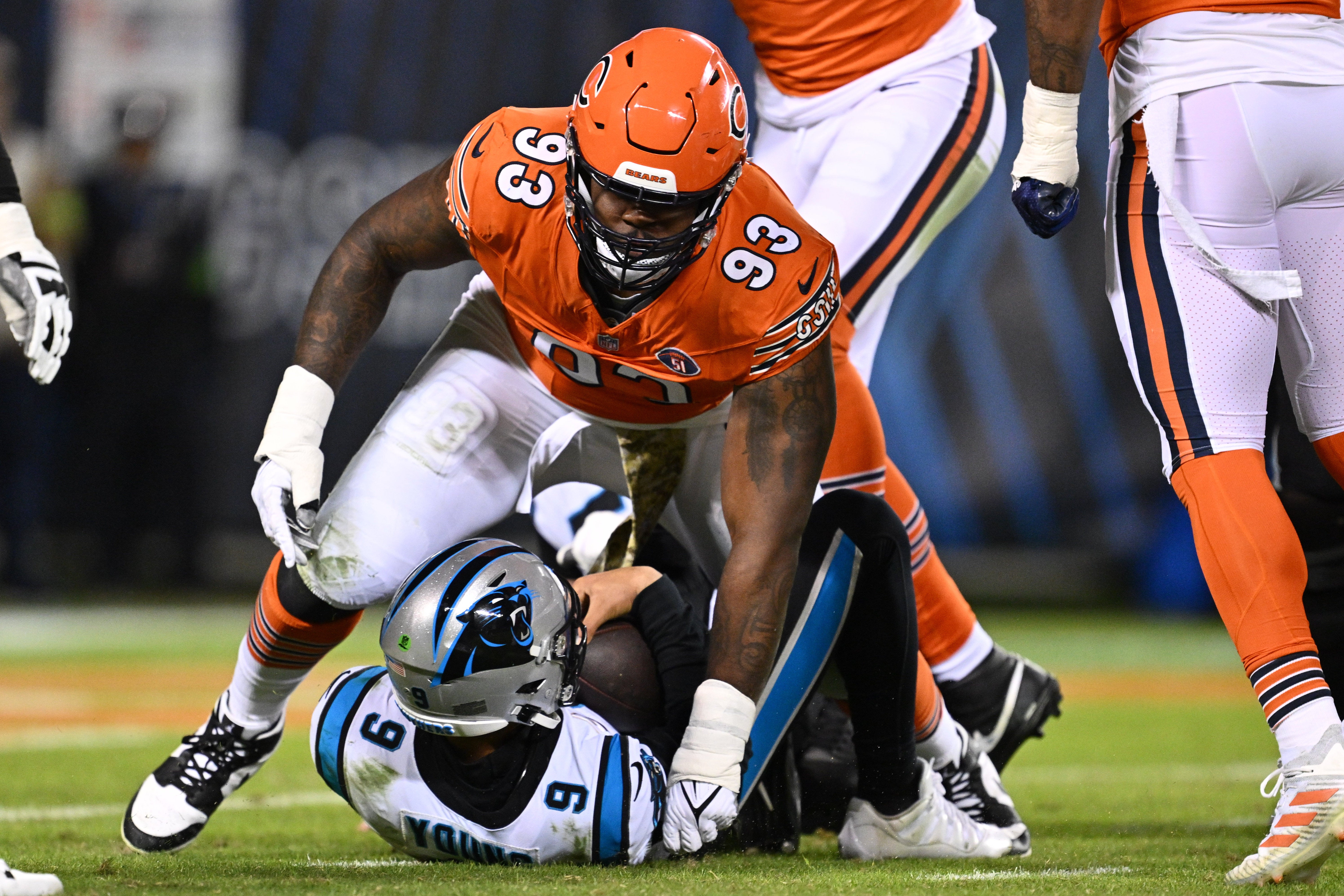 Nov 9, 2023; Chicago, Illinois, USA; Chicago Bears defensive lineman Justin Jones (93) reacts after sacking Carolina Panthers quarterback Bryce Young (9) in the first half at Soldier Field.