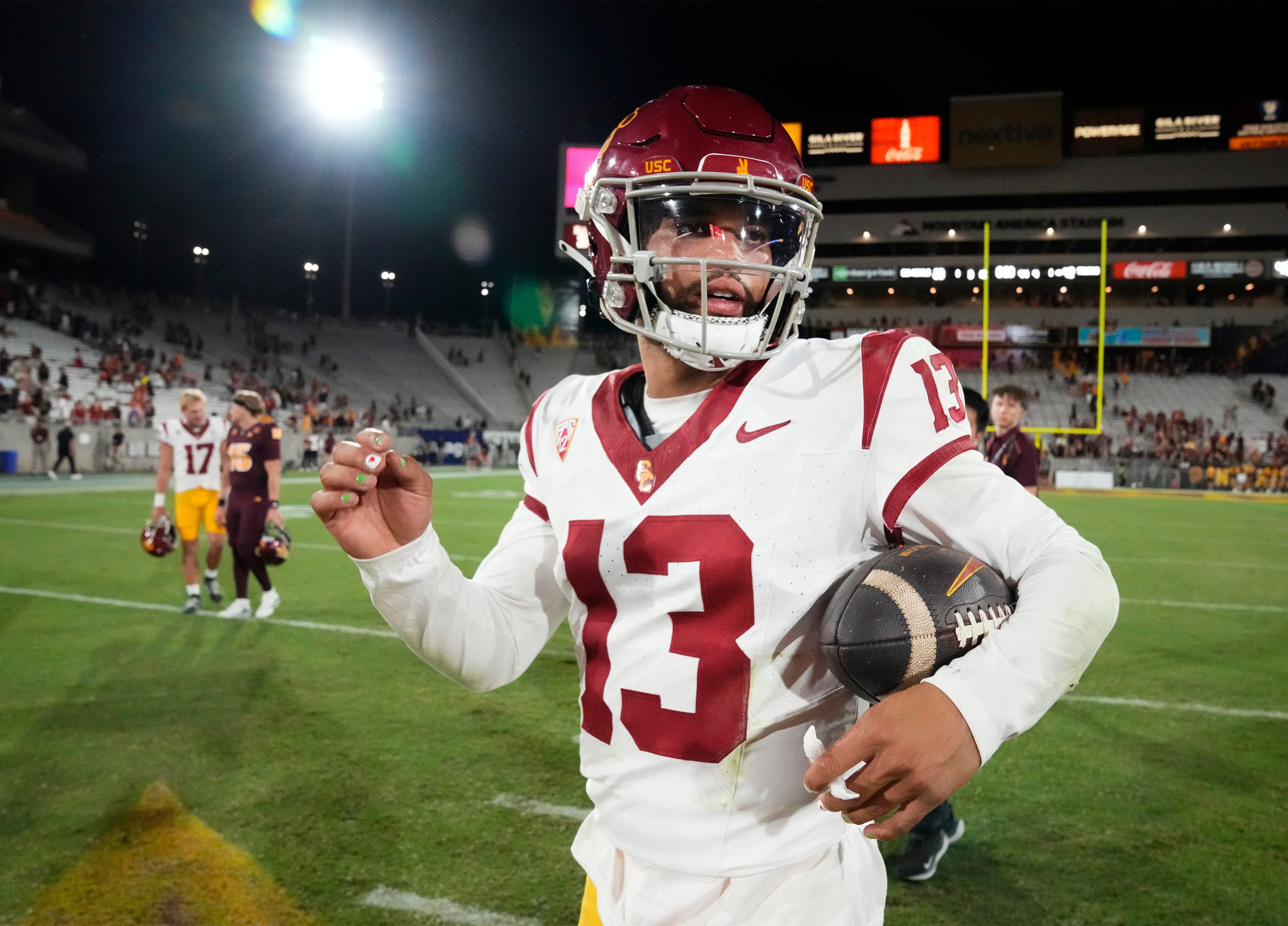 USC Trojans quarterback Caleb Williams (13) leaves the field after a 42-28 victory over the Arizona State Sun Devils at Mountain America Stadium in Tempe on Sept. 23, 2023.