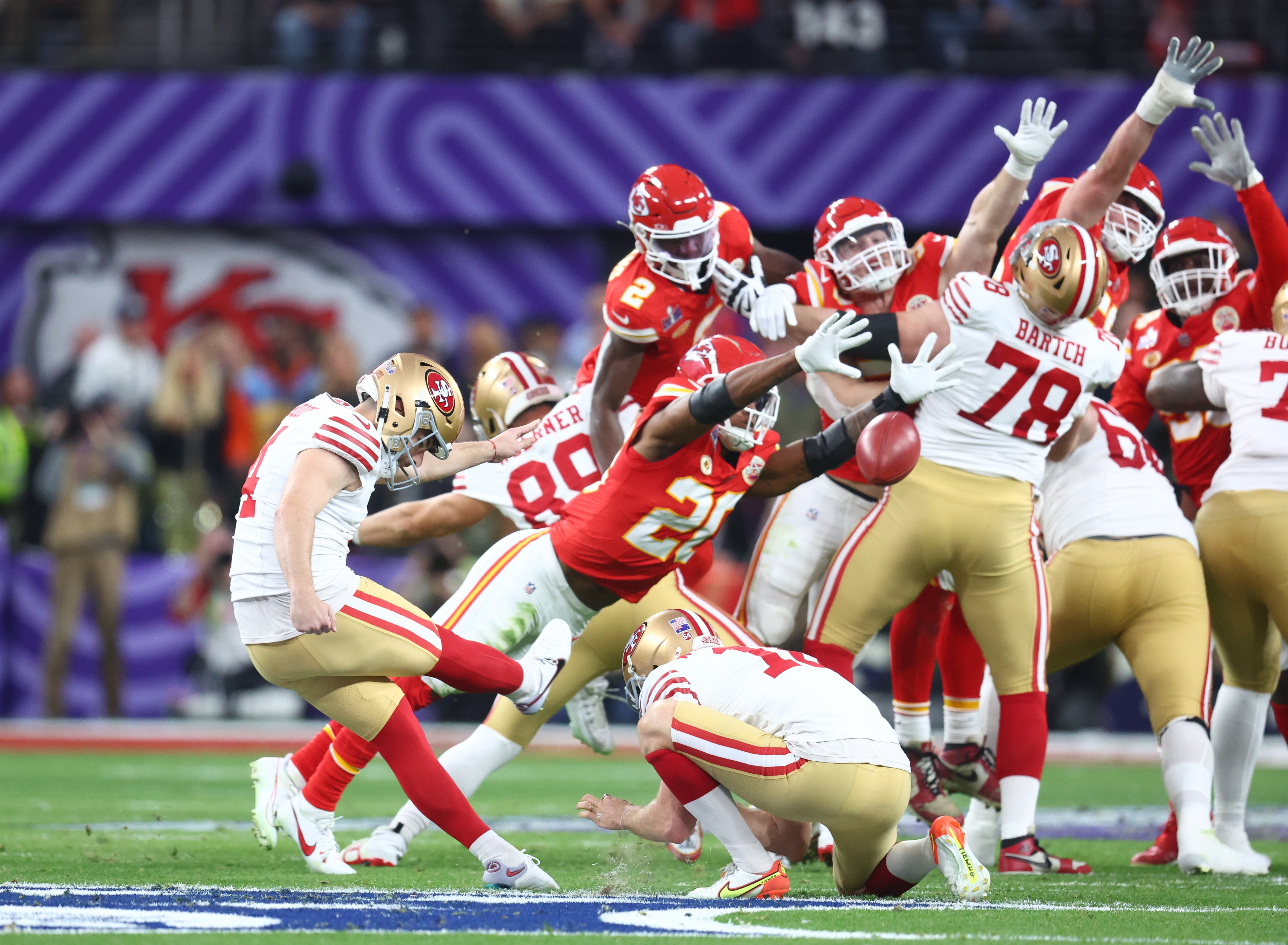 Feb 11, 2024; Paradise, Nevada, USA; San Francisco 49ers place kicker Jake Moody (4) kicks a field goal against the Kansas City Chiefs in the first half in Super Bowl LVIII at Allegiant Stadium.