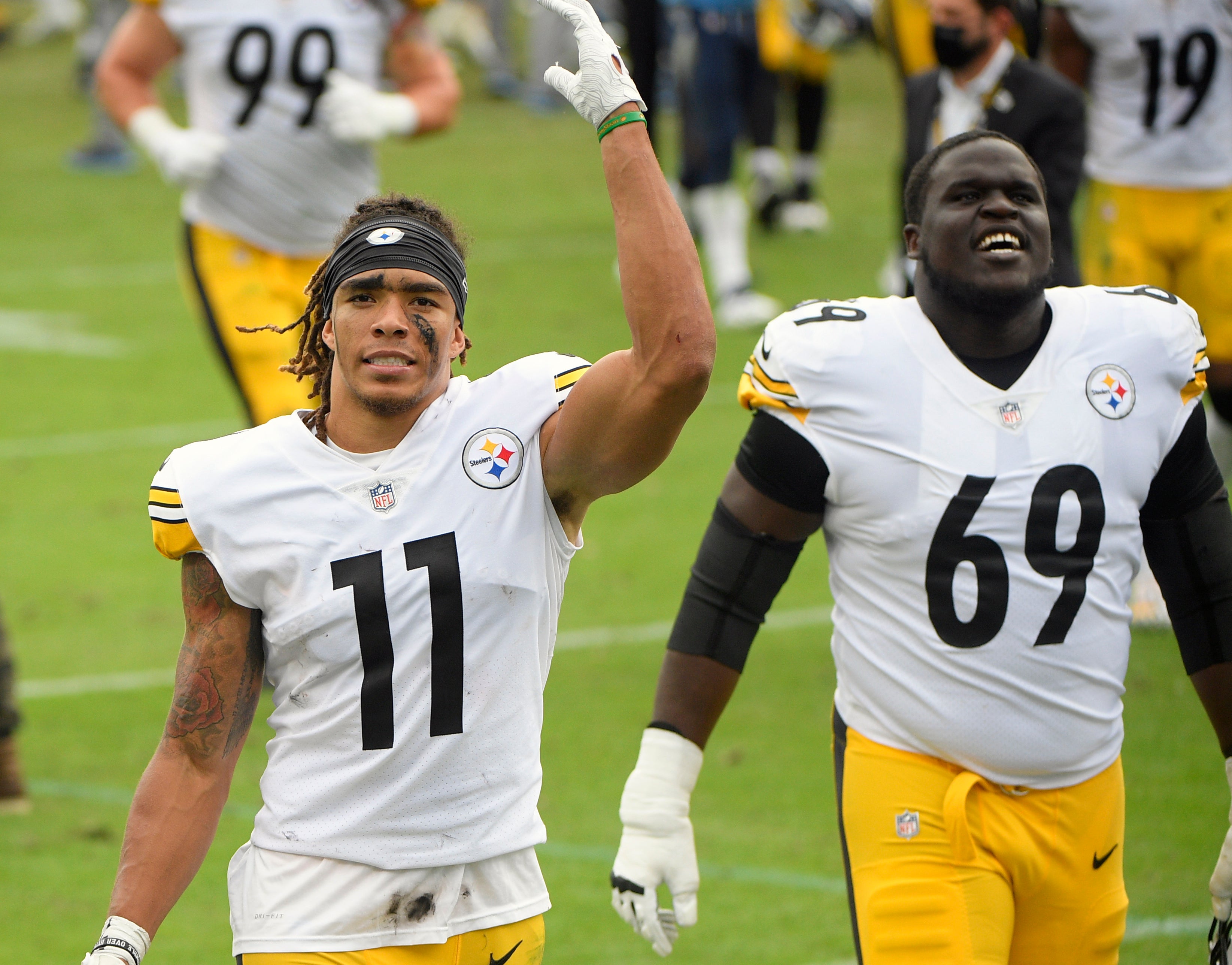 Oct 25, 2020; Nashville, Tennessee, USA; Pittsburgh Steelers wide receiver Chase Claypool (11) and offensive guard Kevin Dotson (69) smile after the win over Tennessee Titans during the second half at Nissan Stadium. Mandatory Credit: Steve Roberts-USA TODAY Sports
