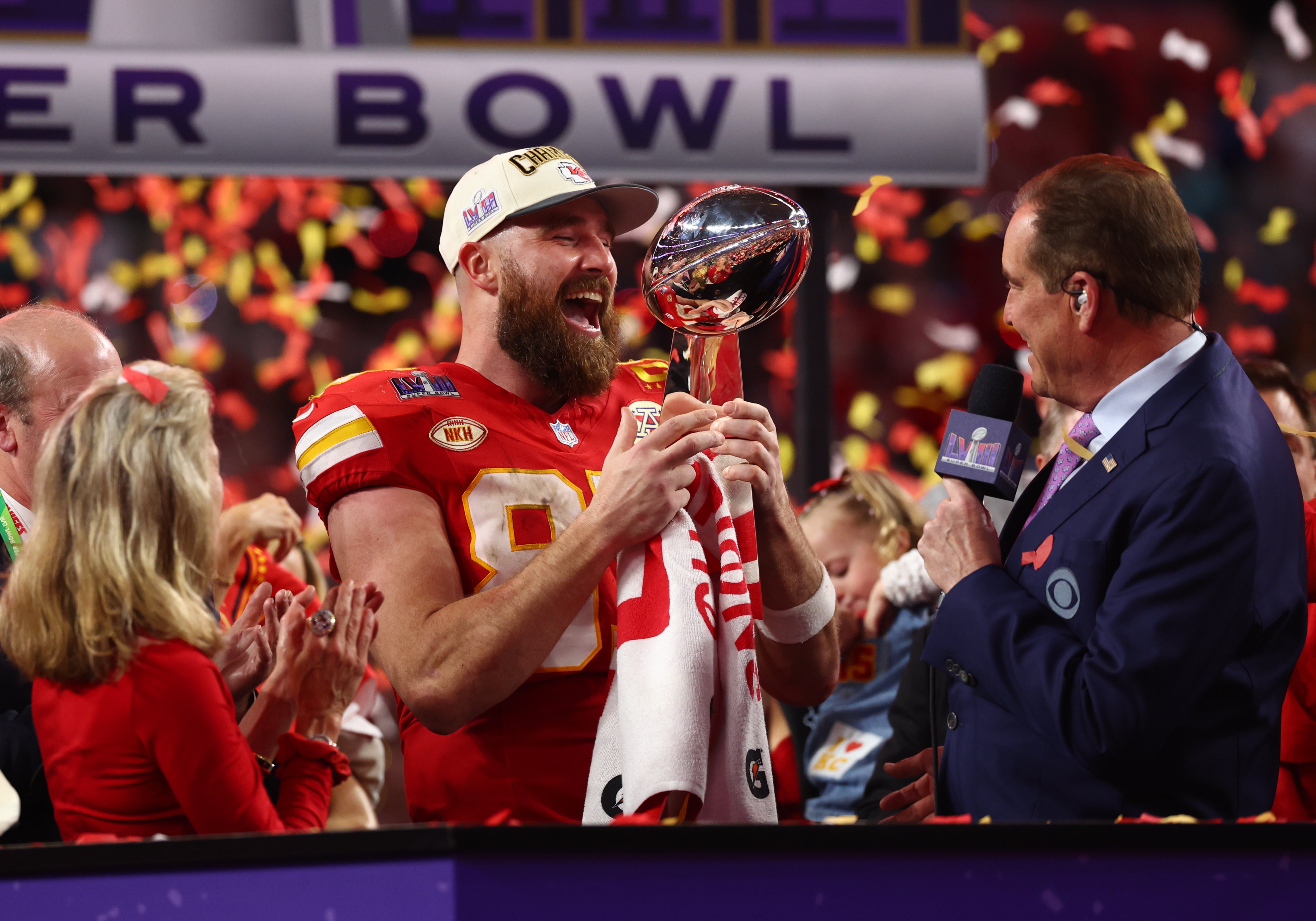 Feb 11, 2024; Paradise, Nevada, USA; Kansas City Chiefs tight end Travis Kelce (87) celebrates with the Vince Lombardi Trophy after defeating the San Francisco 49ers in Super Bowl LVIII at Allegiant Stadium.