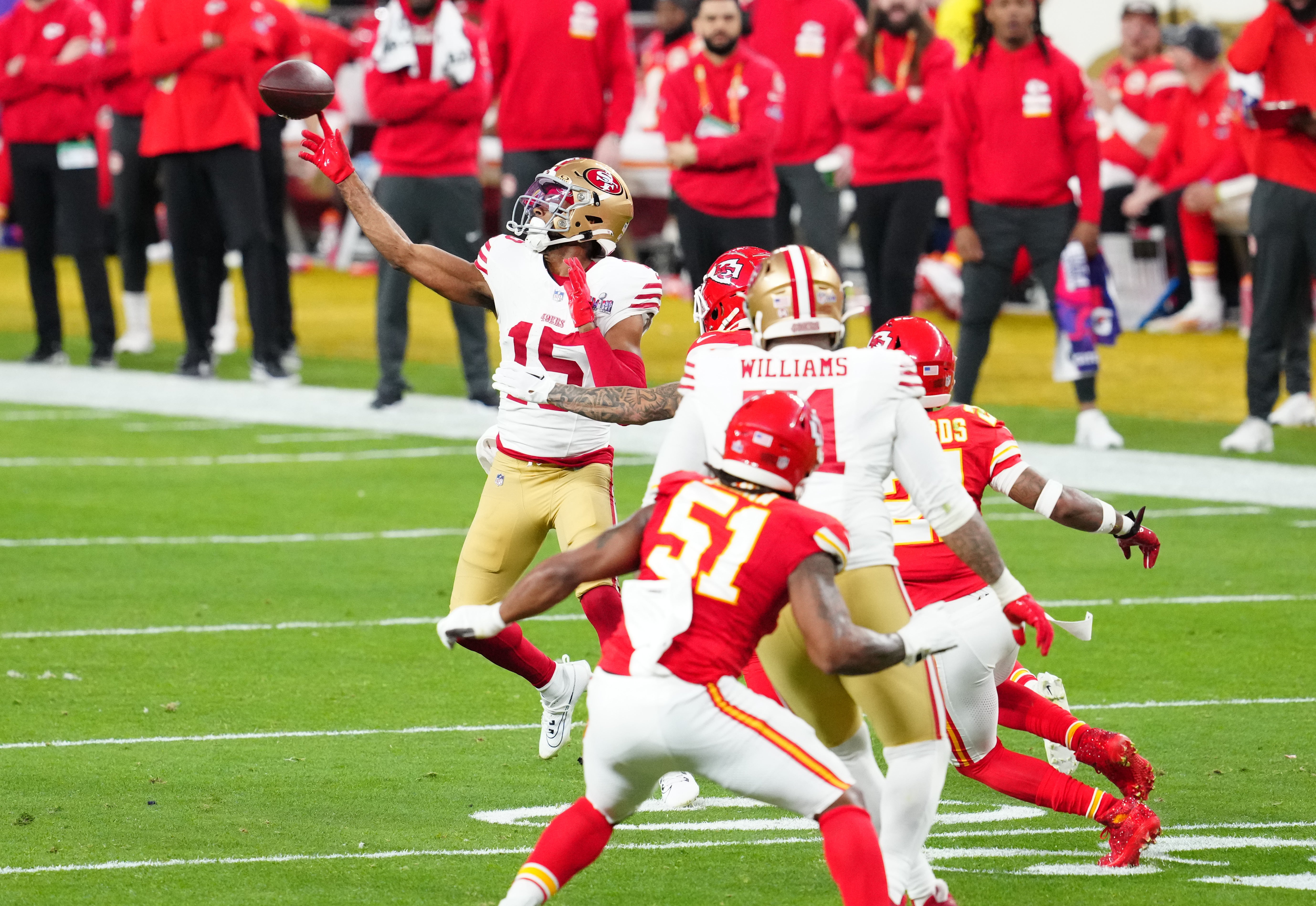 Feb 11, 2024; Paradise, Nevada, USA; San Francisco 49ers wide receiver Jauan Jennings (15) throws a touchdown pass to running back Christian McCaffrey (not pictured) against the Kansas City Chiefs in the first half in Super Bowl LVIII at Allegiant Stadium.