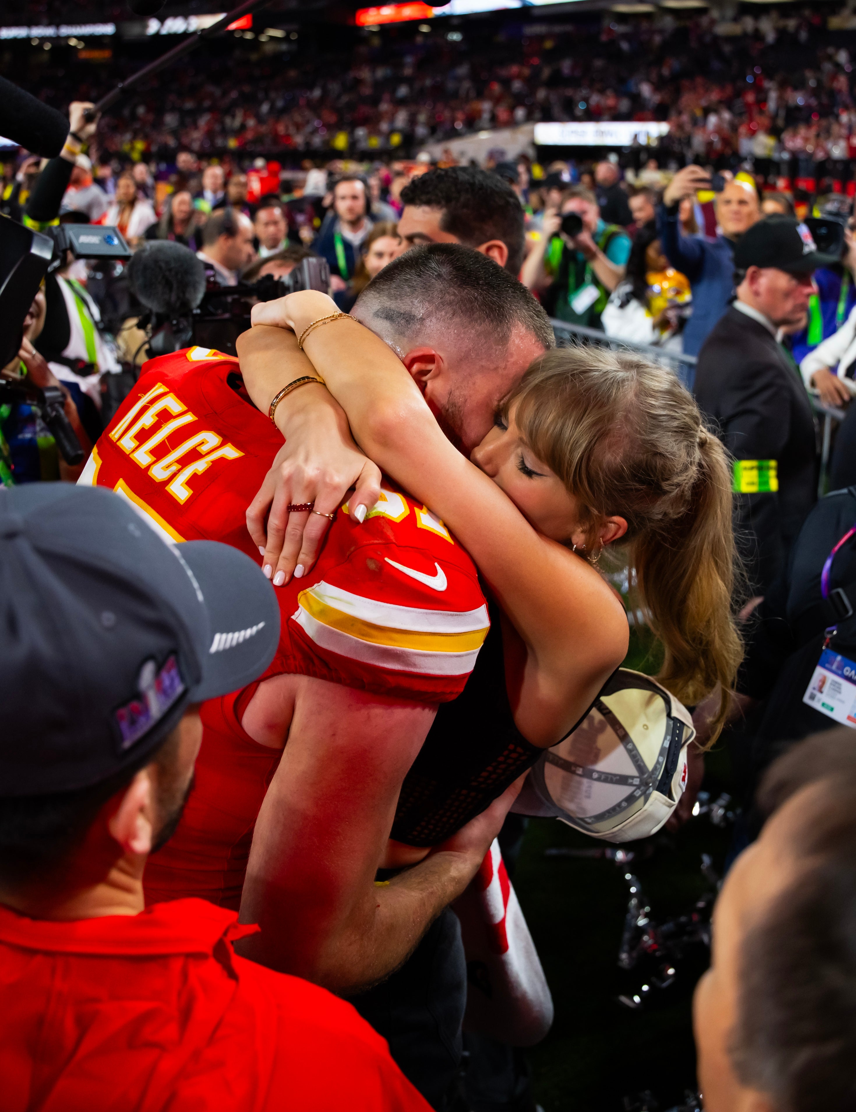 Feb 11, 2024; Paradise, Nevada, USA; Kansas City Chiefs tight end Travis Kelce (87) celebrates with girlfriend Taylor Swift after defeating the San Francisco 49ers in Super Bowl LVIII at Allegiant Stadium.