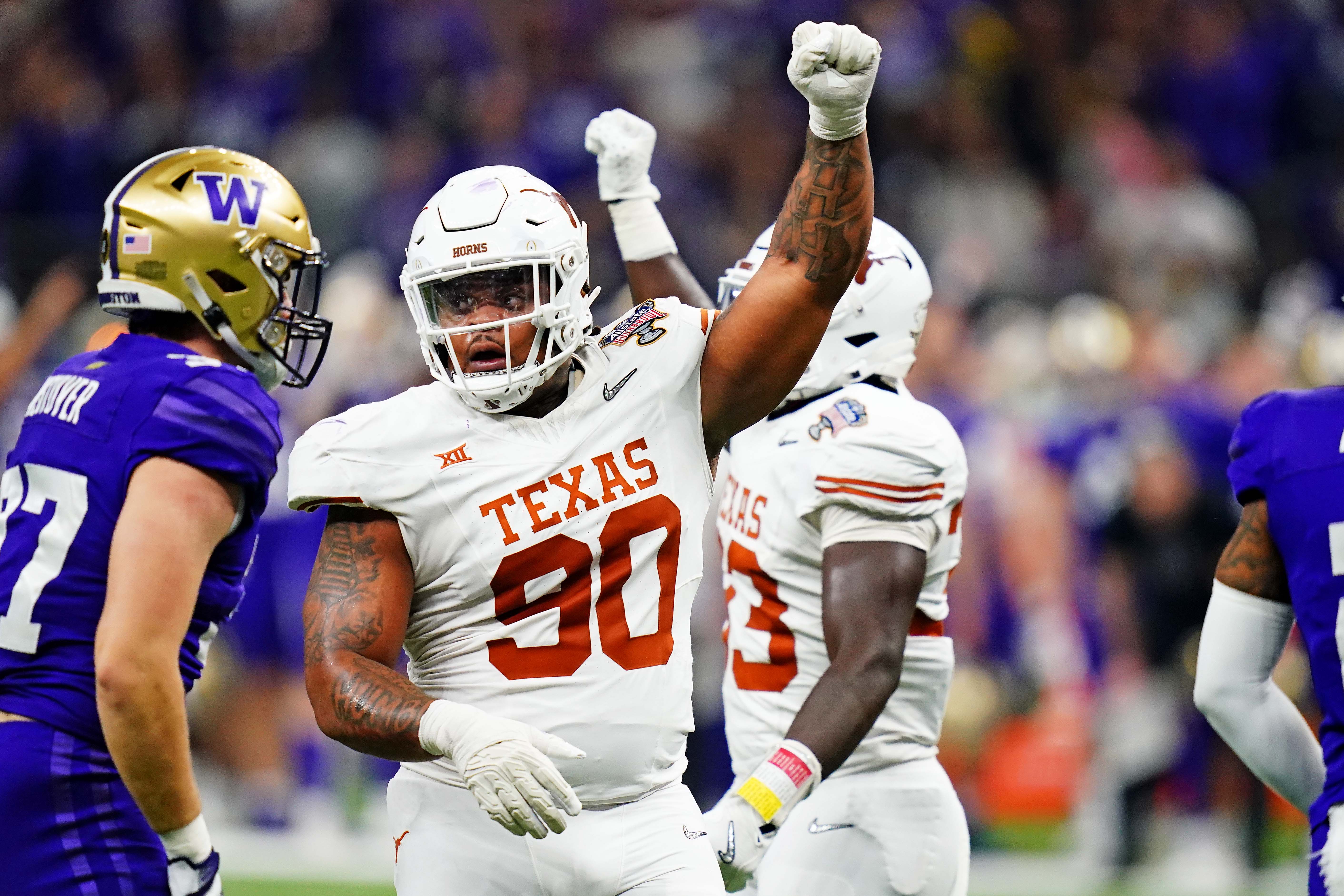 Jan 1, 2024; New Orleans, LA, USA; Texas Longhorns defensive lineman Byron Murphy II (90) celebrates after a play during the second quarter in the 2024 Sugar Bowl college football playoff semifinal game at Caesars Superdome.