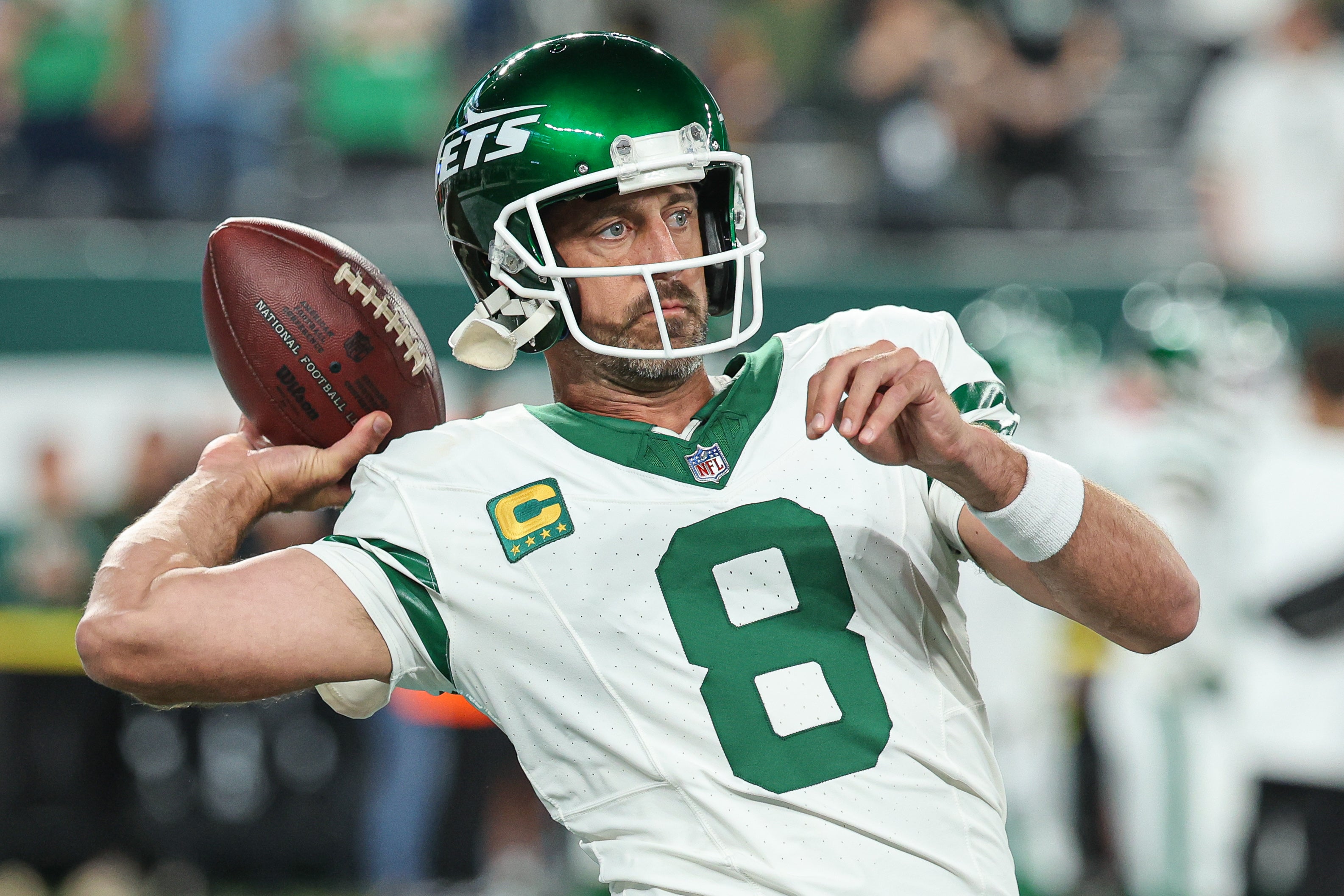 New York Jets quarterback Aaron Rodgers (8) warms up before the game against the Buffalo Bills at MetLife Stadium.